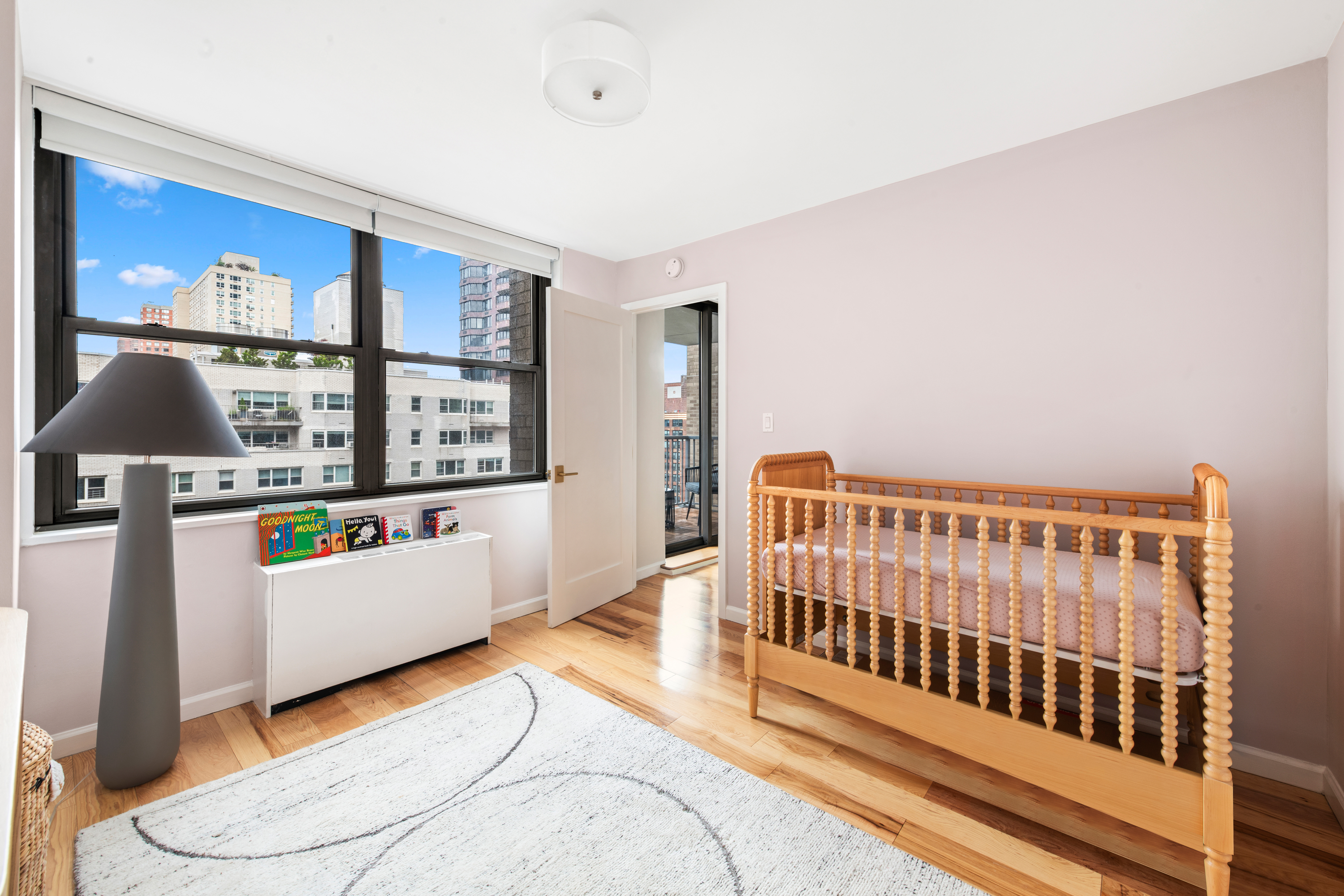 444 East 86th Street, Unit 16B Manhattan, NY 10028 - Photo 7 of 14 a bedroom with furniture and window
