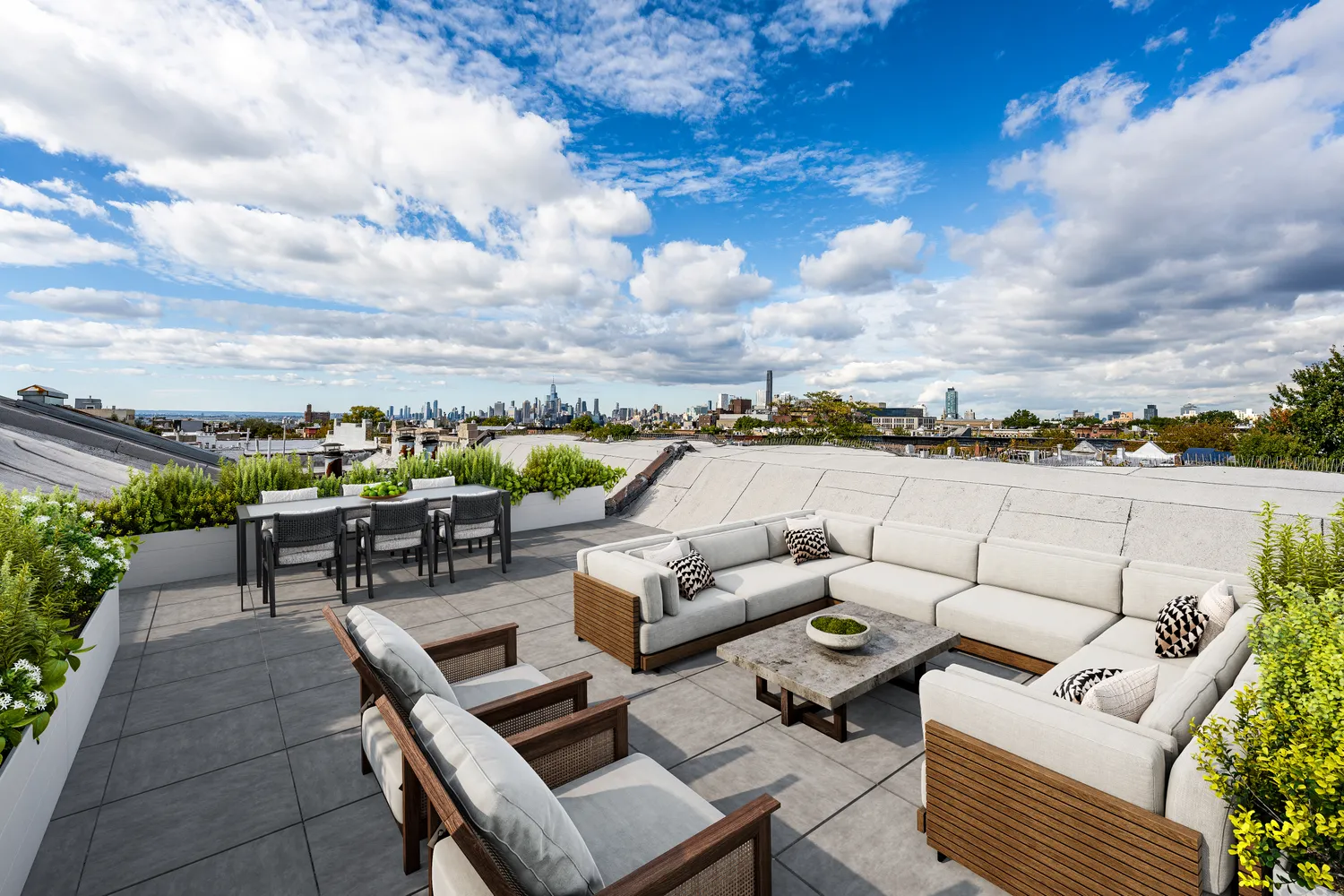 a terrace with outdoor seating and city view