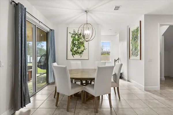 a kitchen with stainless steel appliances kitchen island granite countertop a stove a sink and a refrigerator