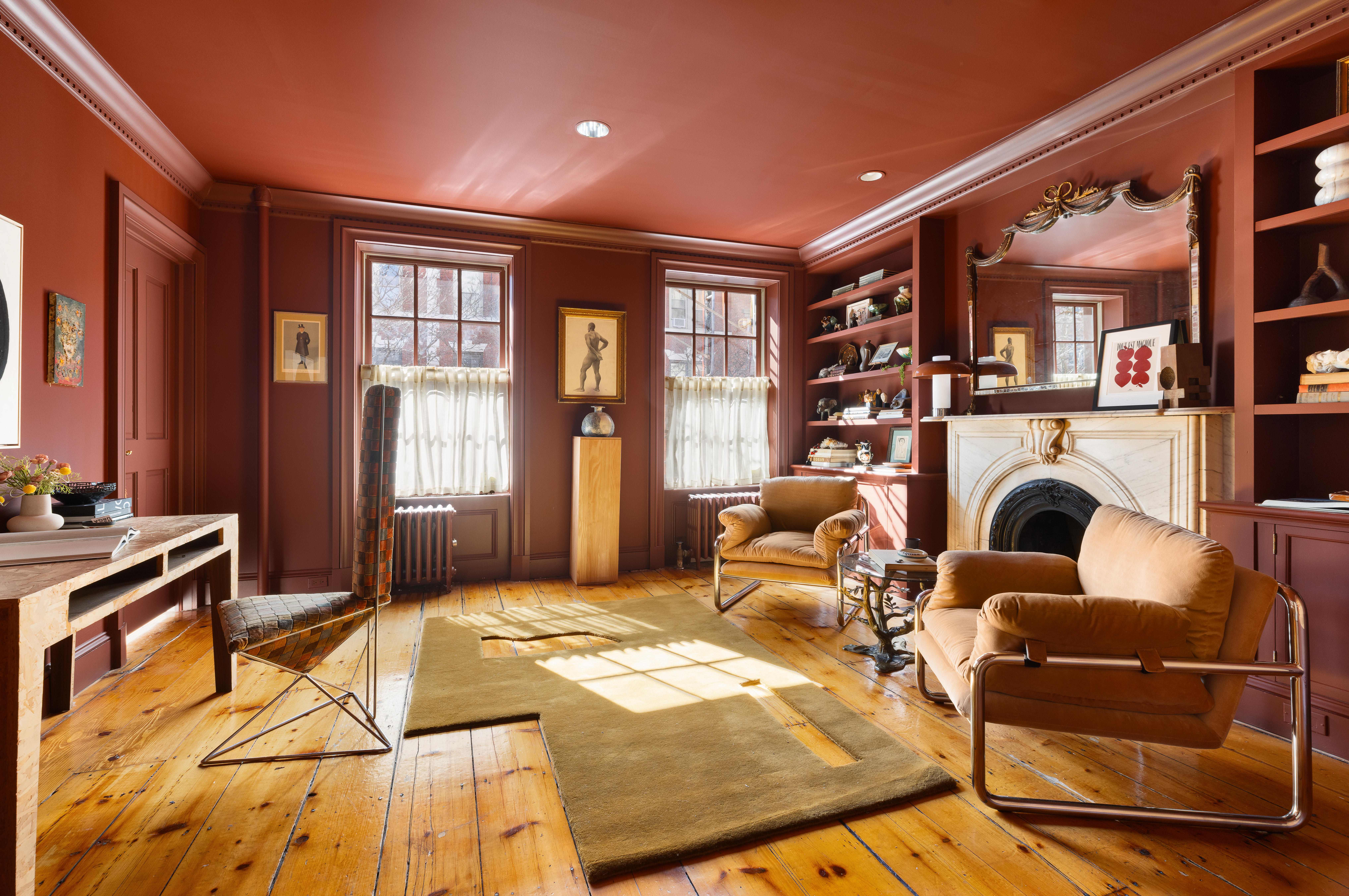 313 West 20th Street Manhattan, NY 10011 - Photo 13 of 20 a bedroom with furniture and a fireplace