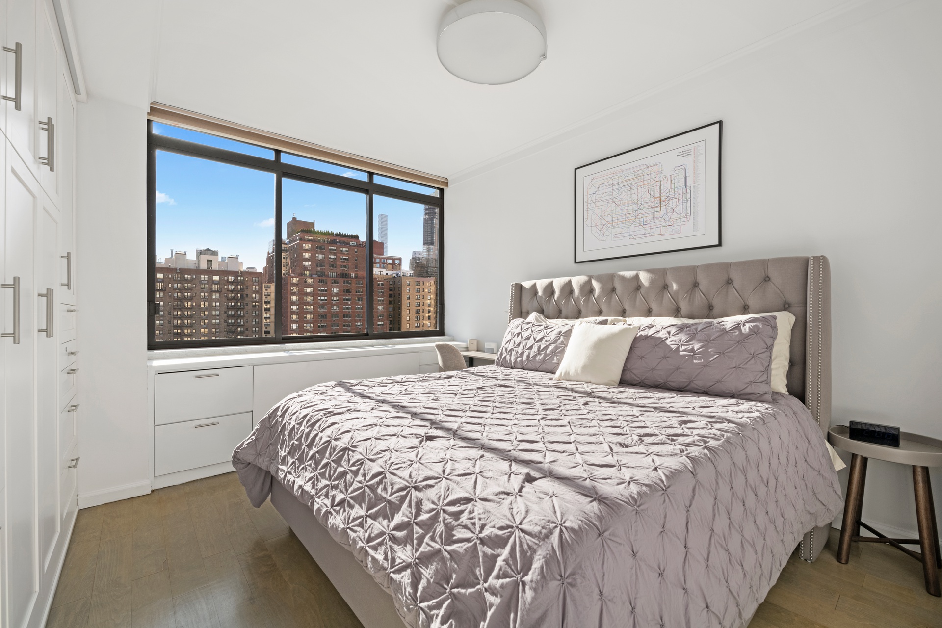 343 East 74th Street, Unit 14K Manhattan, NY 10021 - Photo 5 of 7 a bedroom with a large bed and a window