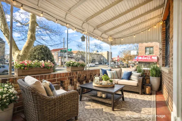 a outdoor living space with patio furniture and a potted plant