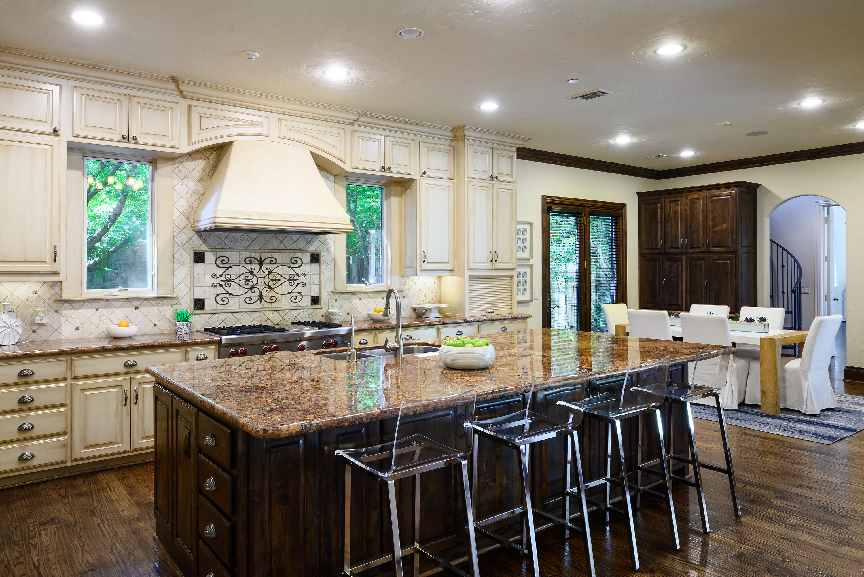 11503 West Ricks Circle Dallas, TX 75230 - Photo 16 of 39 a kitchen with kitchen island granite countertop a sink and a stove