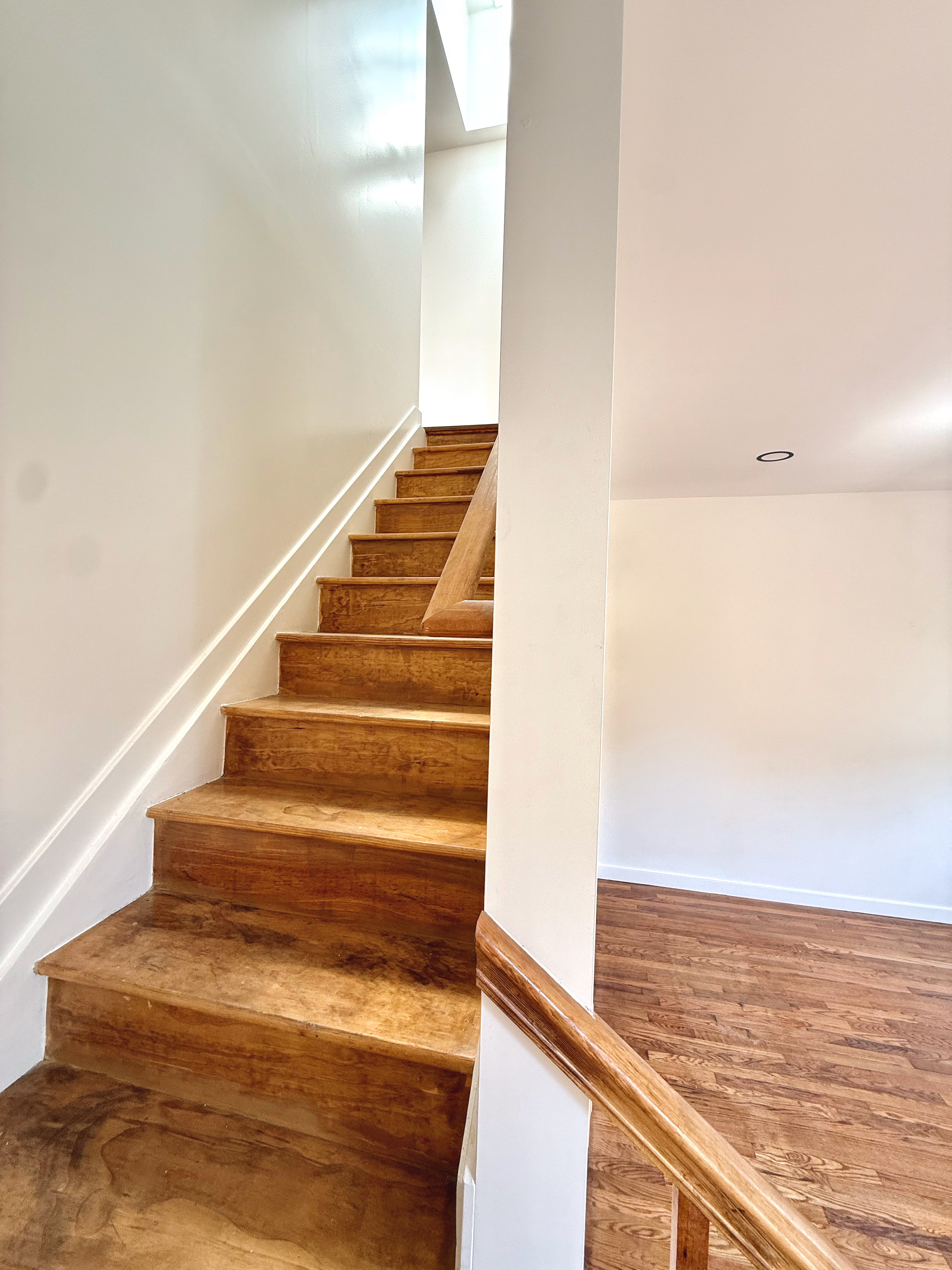 14 Vermont Court, Unit F Brooklyn, NY 11207 - Photo 6 of 10 a view of staircase with white walls and railing