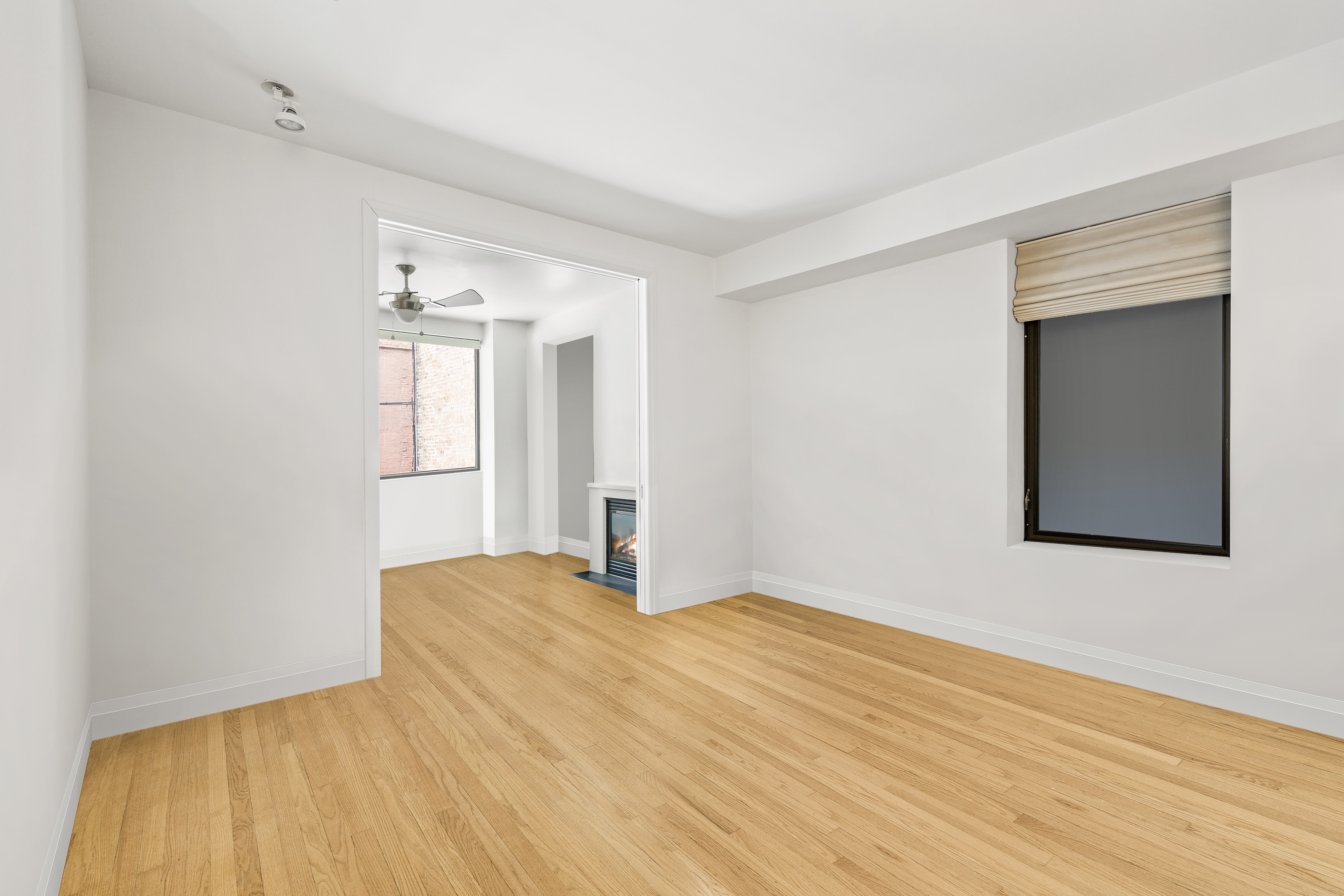 212 East 95th Street, Unit 2C Manhattan, NY 10128 - Photo 4 of 11 a view of empty room with wooden floor