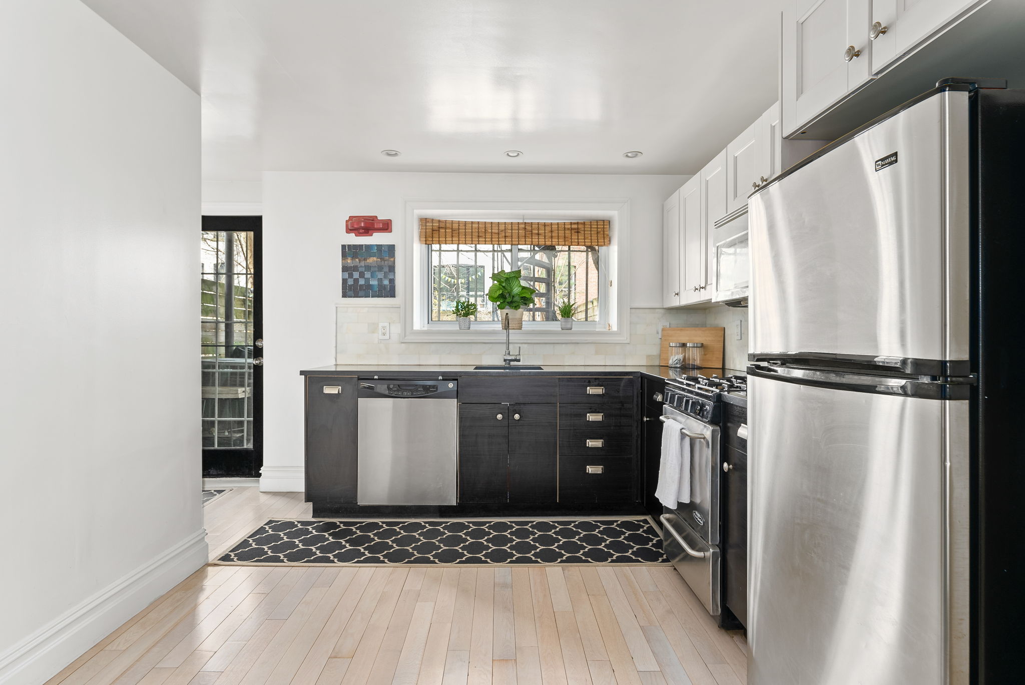 6 Virginia Place Brooklyn, NY 11213 - Photo 16 of 26 a kitchen with stainless steel appliances granite countertop a refrigerator and a stove