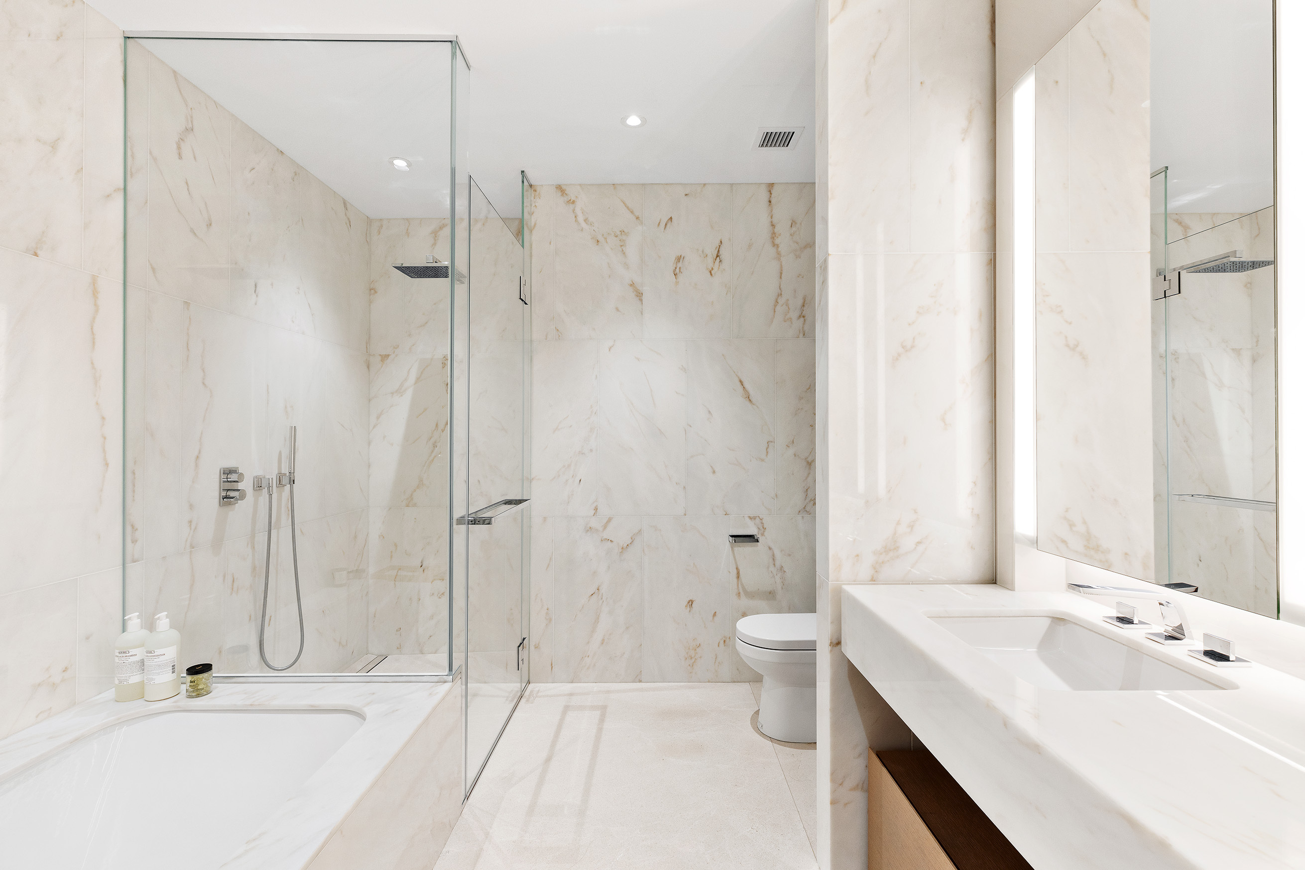15 Hudson Yards, Unit 33J Manhattan, NY 10001 - Photo 4 of 6 a bathroom with a bathtub shower sink and toilet