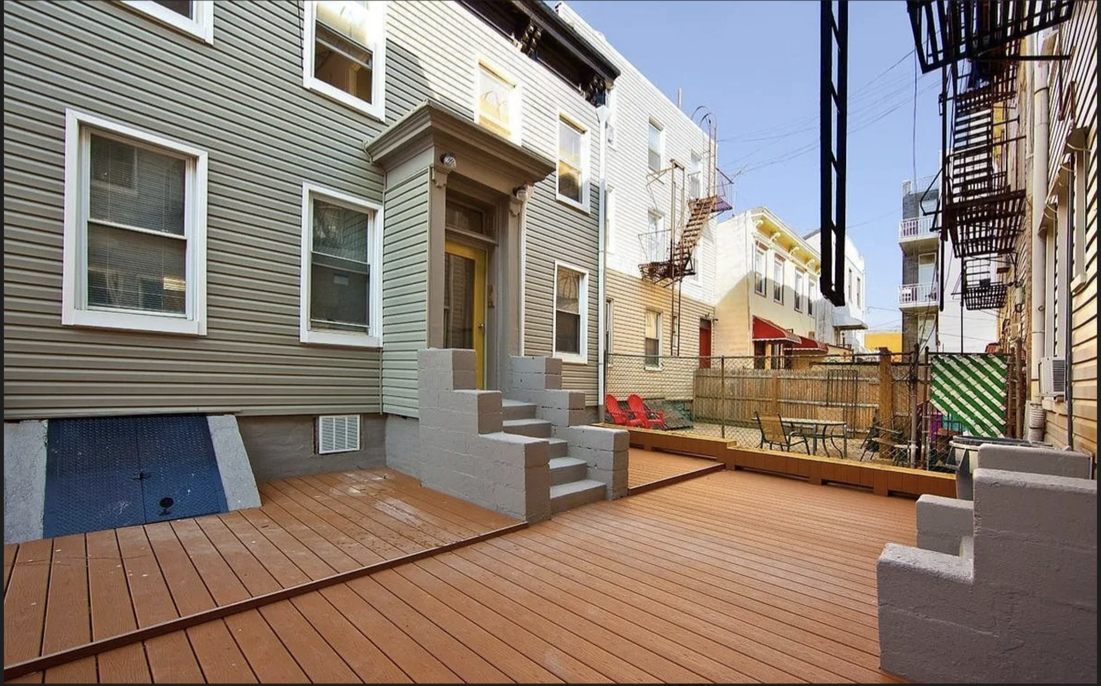 283 Devoe Street, Unit 2RR Brooklyn, NY 11211 - Photo 9 of 11 a view of a rooftop deck with couches and wooden floor