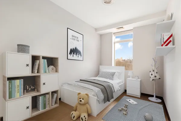 a view of a workspace room with furniture and wooden floor