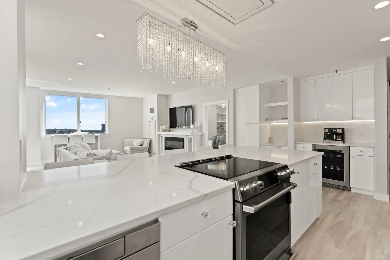 a kitchen with stainless steel appliances granite countertop a sink and a stove
