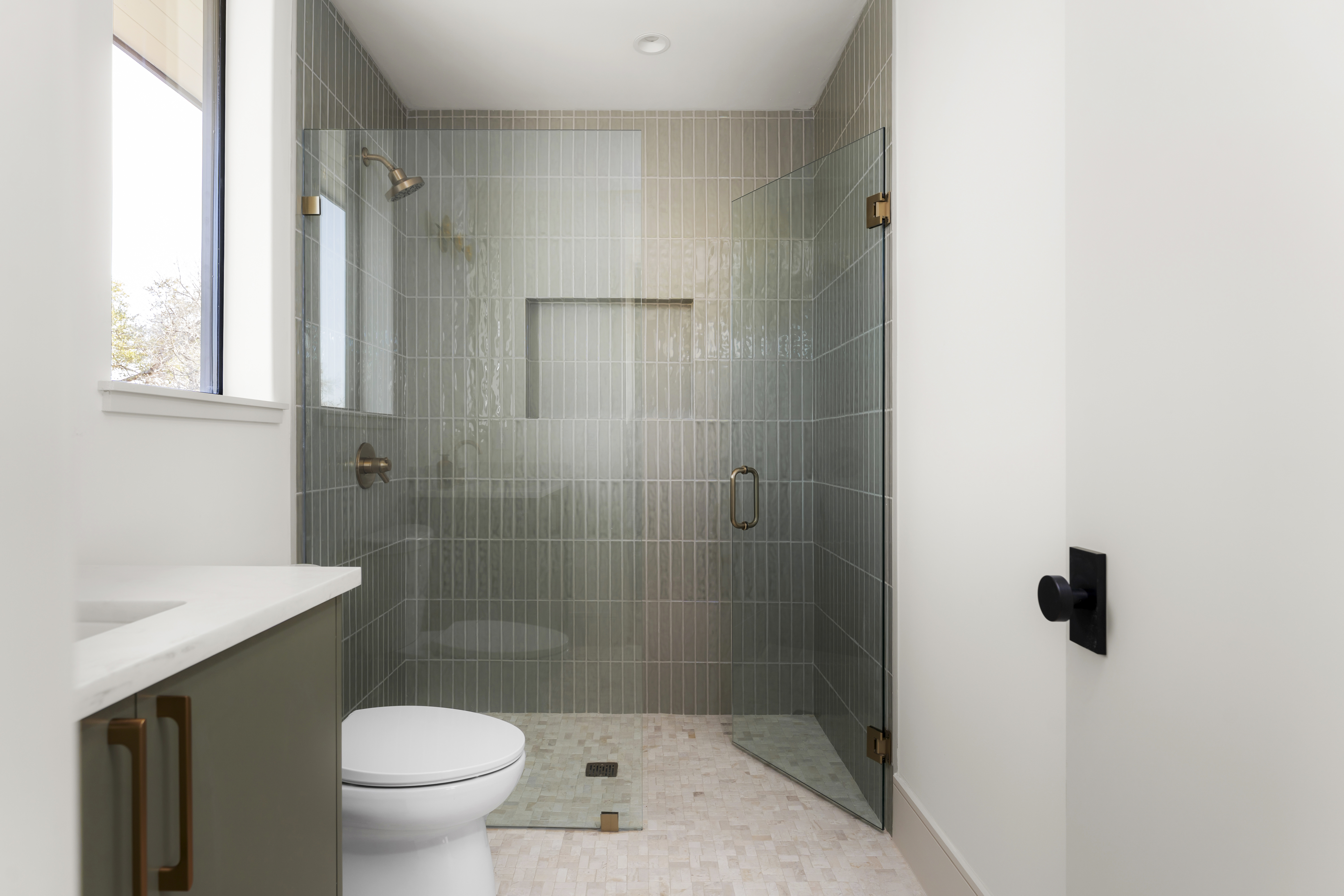 3411 Bridle Path Austin, TX 78703 - Photo 49 of 76 a bathroom with a shower a toilet and a sink