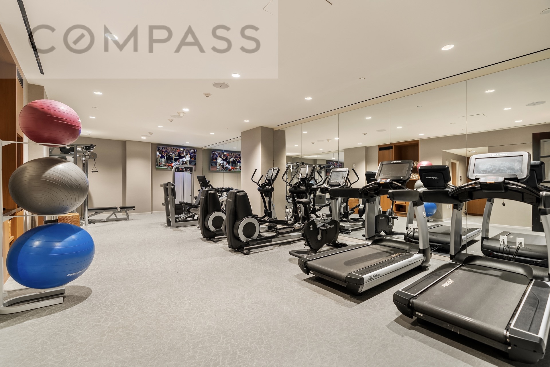 16 West 40th Street, Unit 21B Manhattan, NY 10018 - Photo 16 of 18 a view of a room with gym equipment