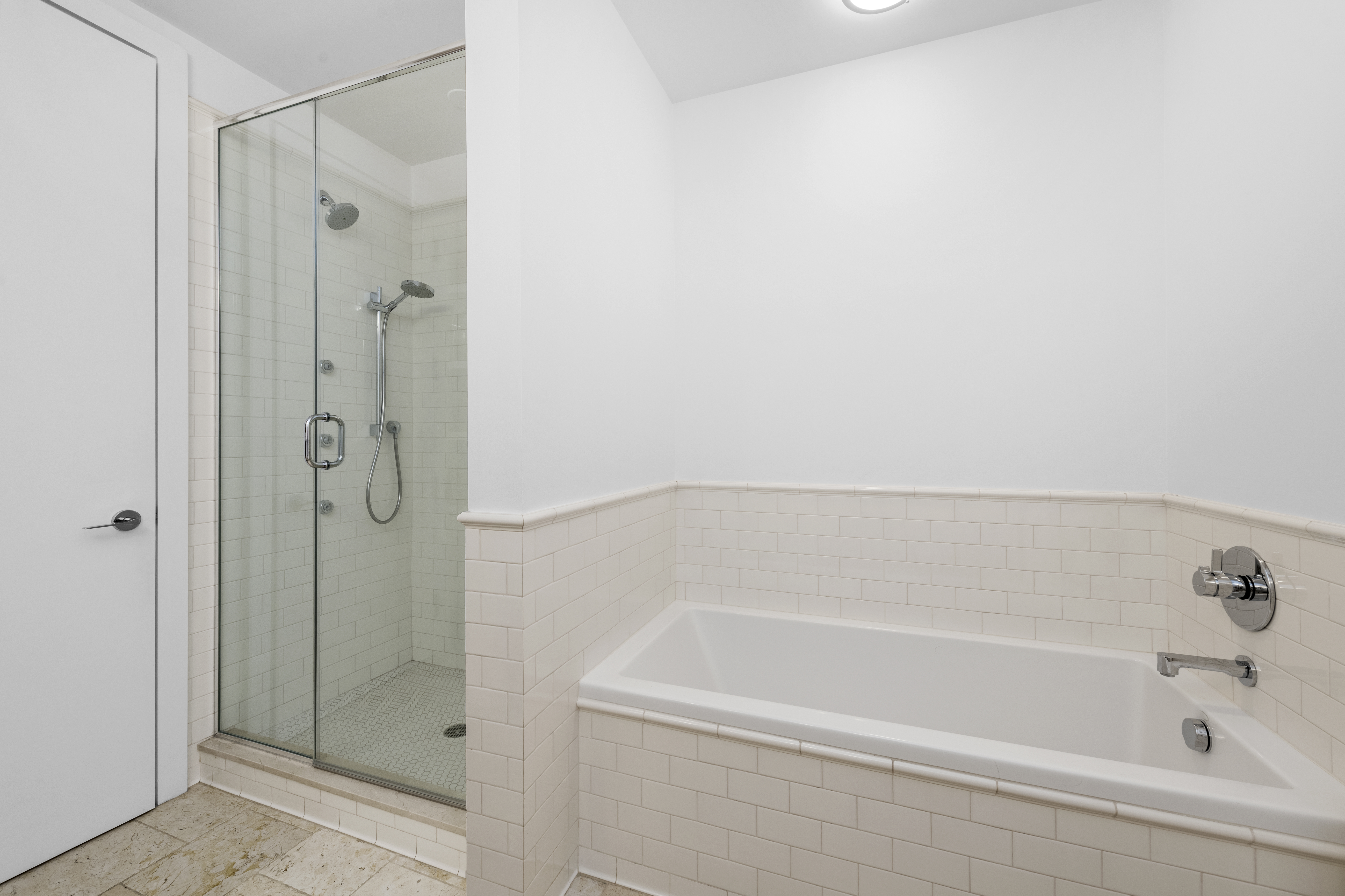 60 Collister Street, Unit 1B Manhattan, NY 10013 - Photo 9 of 20 a bathroom with a bathtub and shower