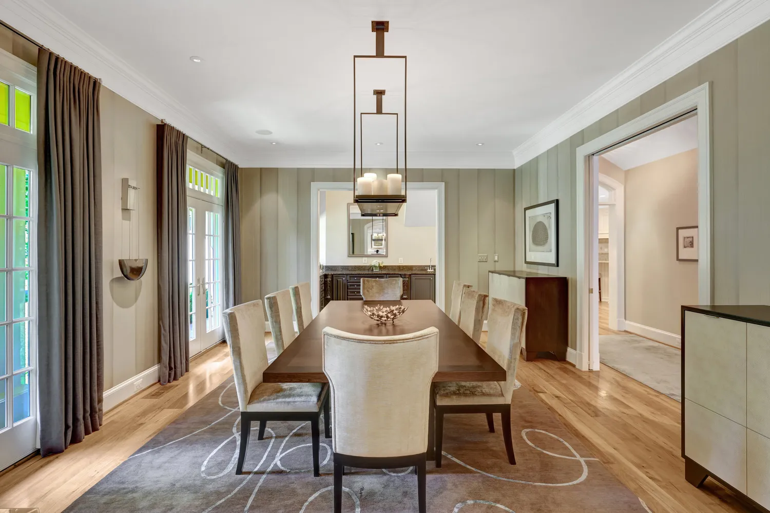 a view of a dining room with furniture a fireplace and wooden floor