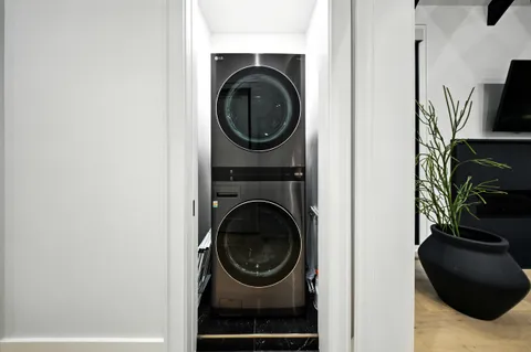 a dining room with furniture and wooden floor