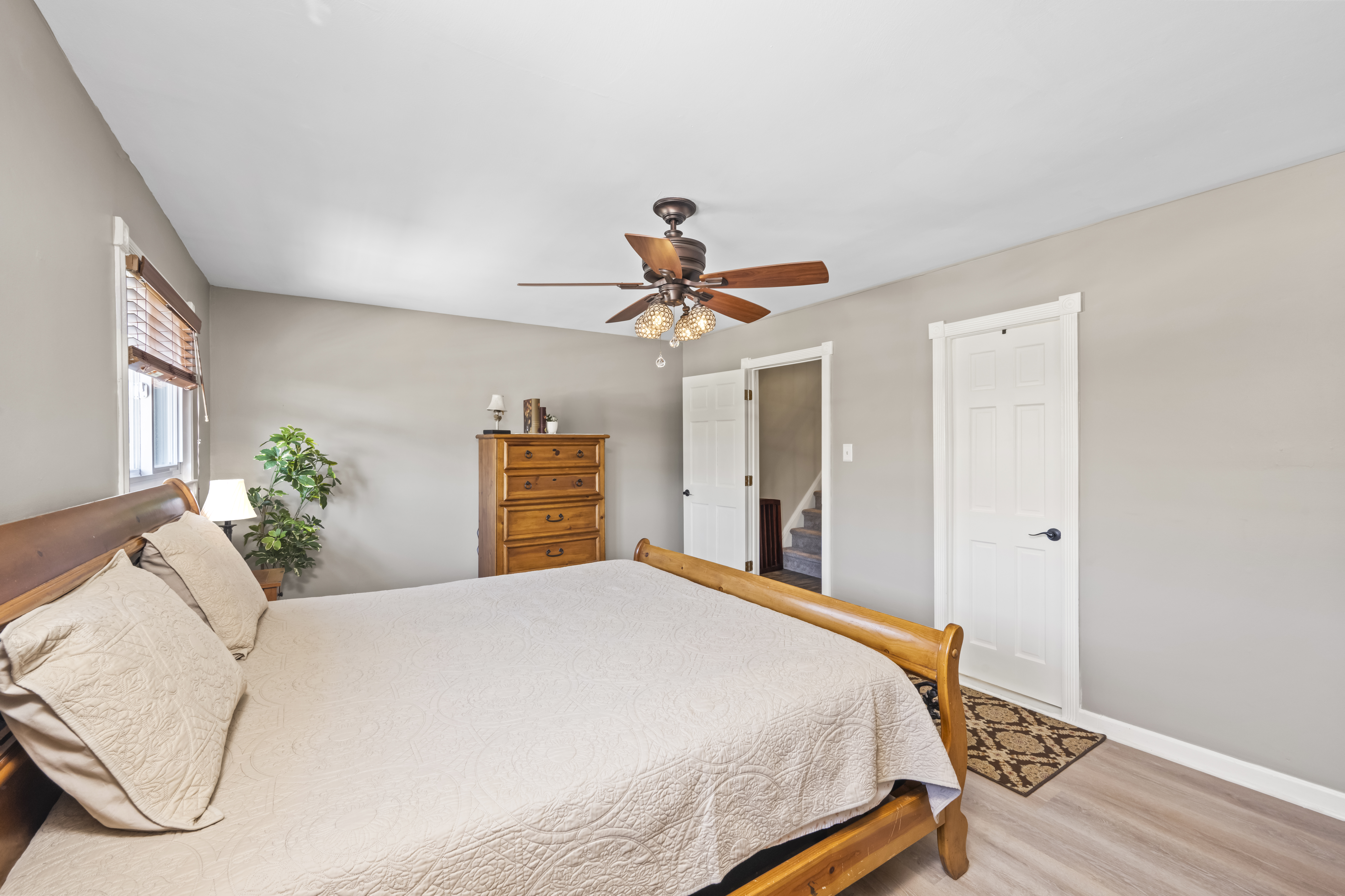 15 Hickory Circle Staten Island, NY 10312 - Photo 25 of 40 a bedroom with a bed and a chandelier
