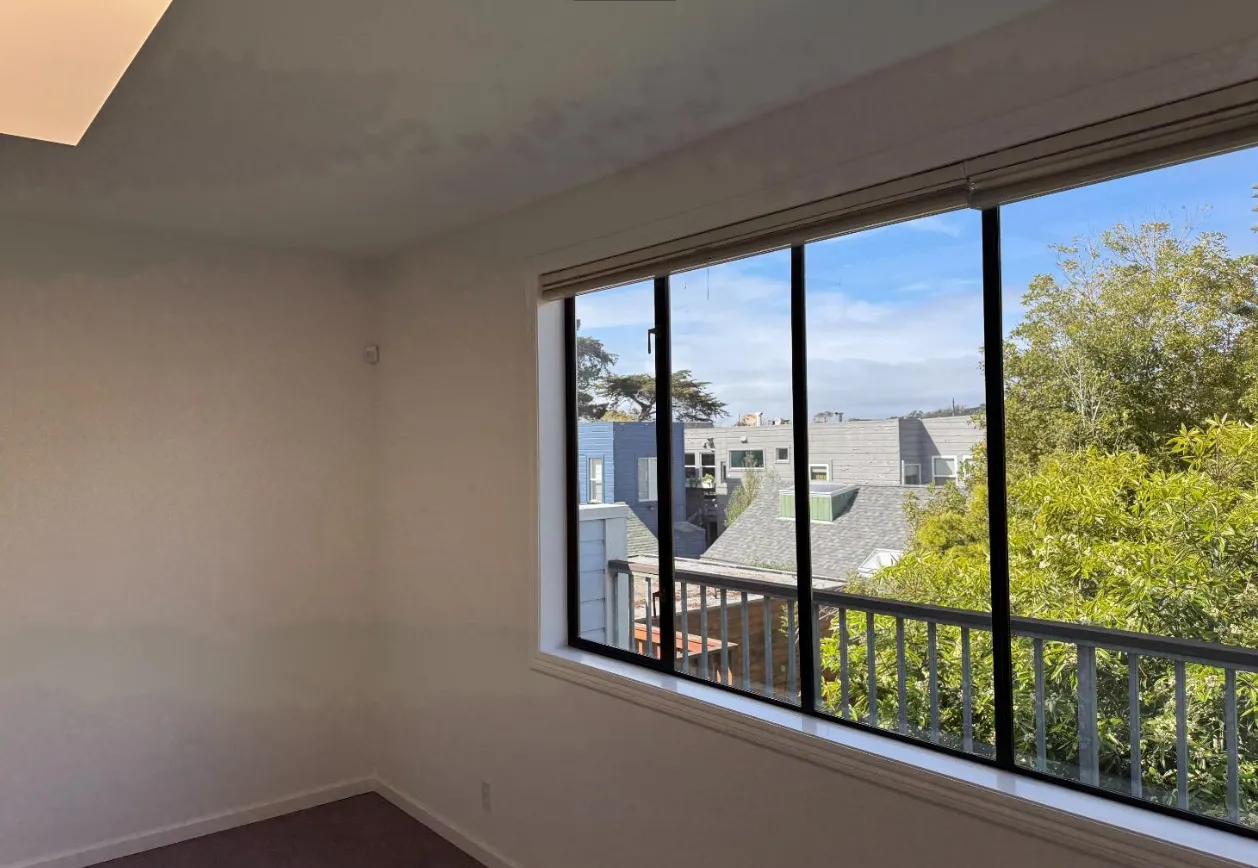 a view of a small space with a large window