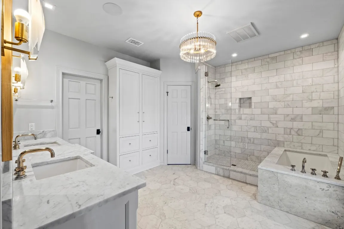 a bathroom with a bathtub and shower