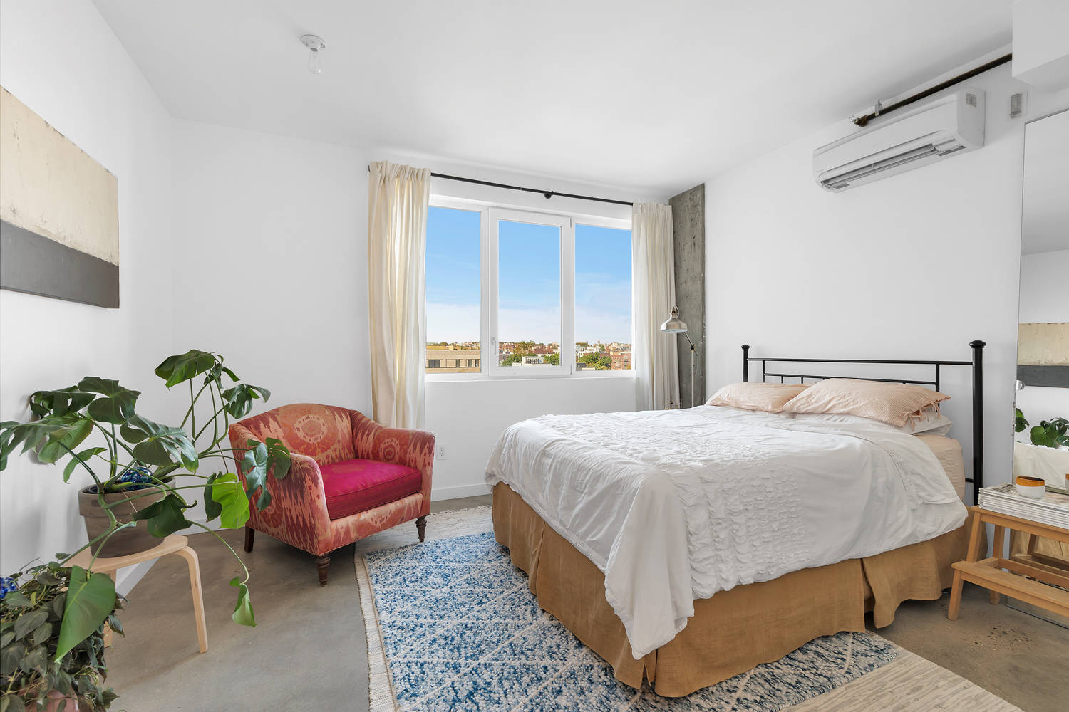 651 New York Avenue, Unit 604 Brooklyn, NY 11203 - Photo 7 of 13 a bedroom with a bed table flowerpot and window