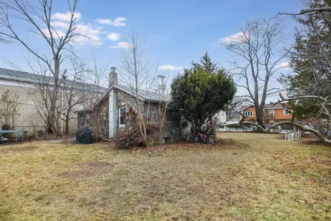a view of a house with a snow in a yard