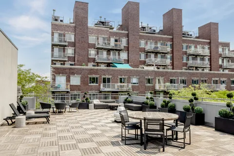 a view of a building with outdoor seating