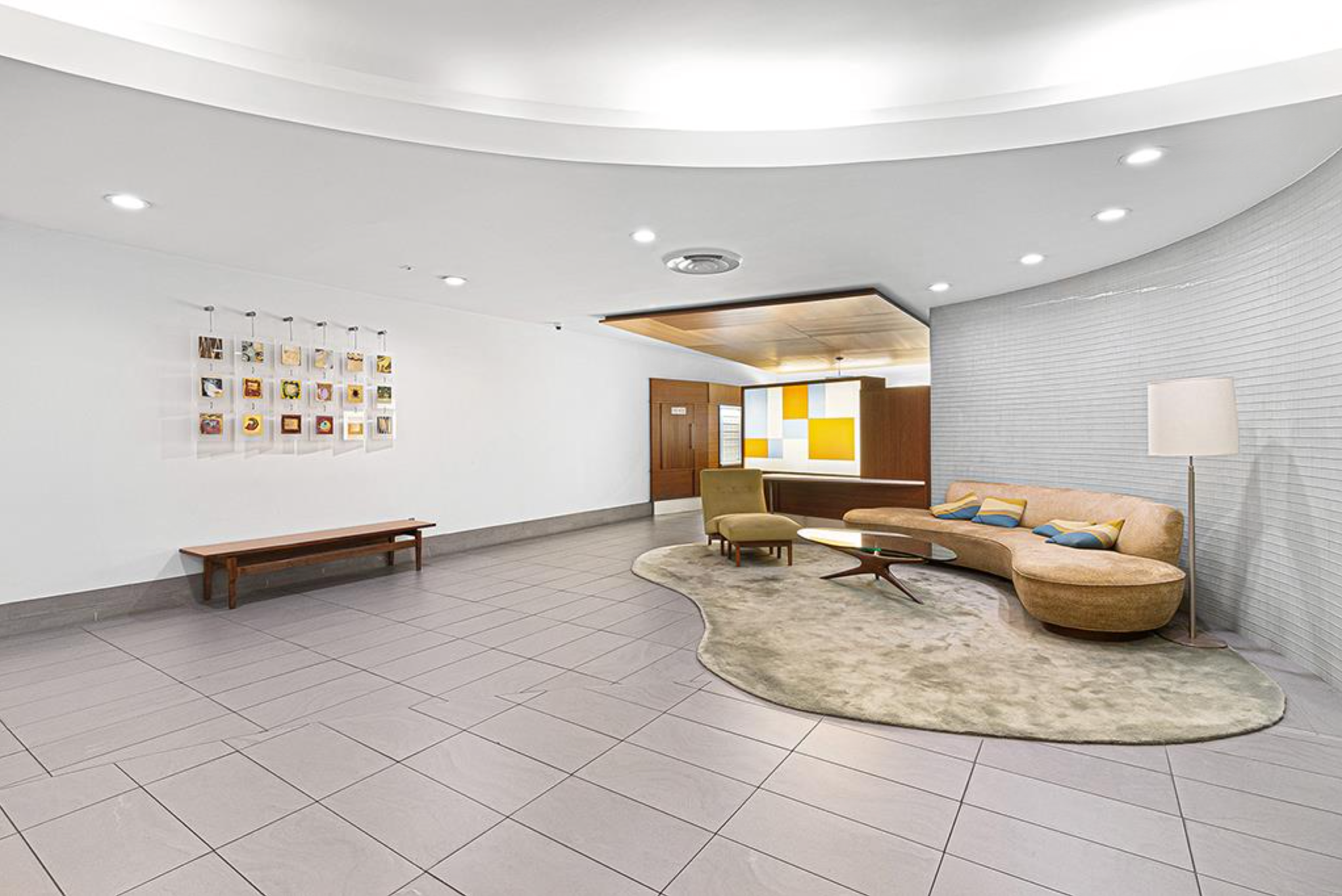 310 East 46th Street, Unit 19F Manhattan, NY 10017 - Photo 15 of 17 a living room with furniture and a table