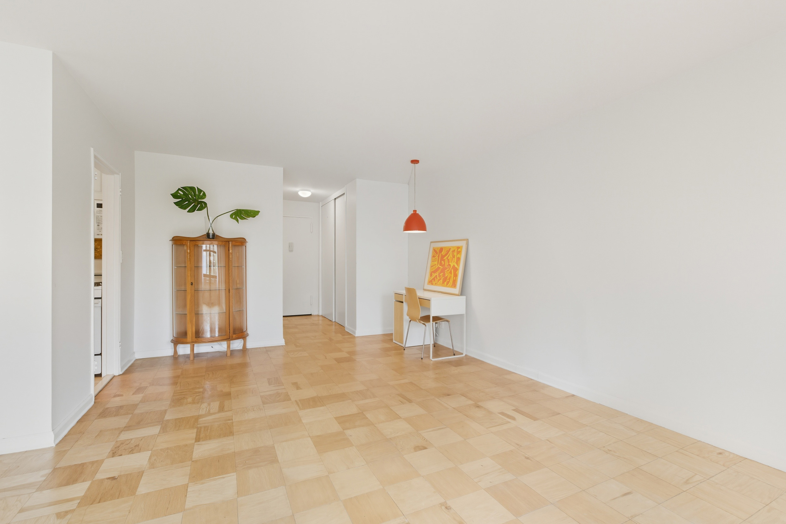 140 West End Avenue, Unit 6D Manhattan, NY 10023 - Photo 13 of 19 a view of a livingroom with wooden floor and a bathroom