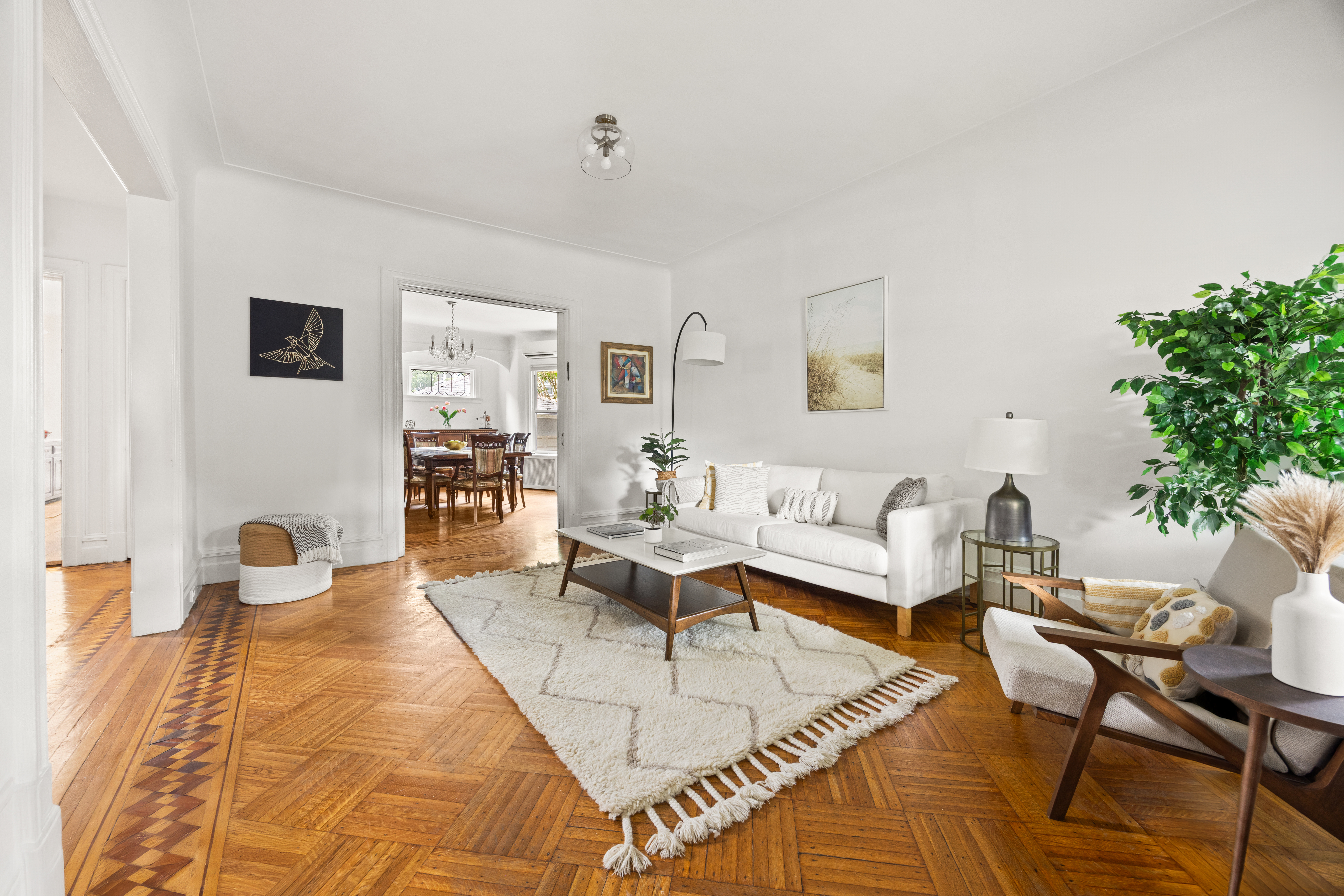 481 Stratford Road Brooklyn, NY 11218 - Photo 6 of 25 a living room with furniture a rug and a potted plant