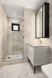 a bathroom with a bathtub and a sink