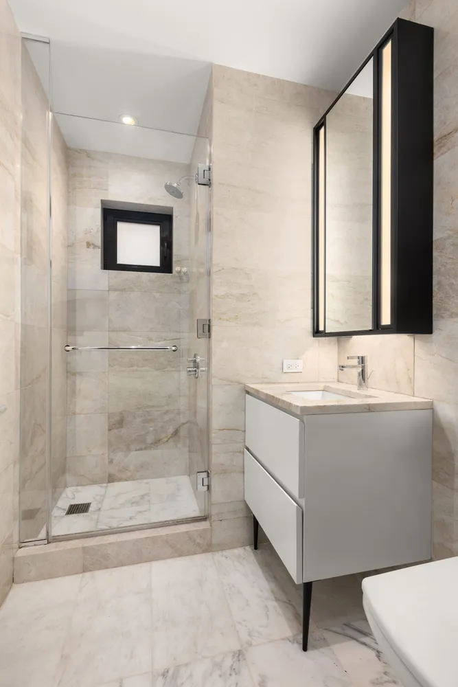 a bathroom with a bathtub and a sink