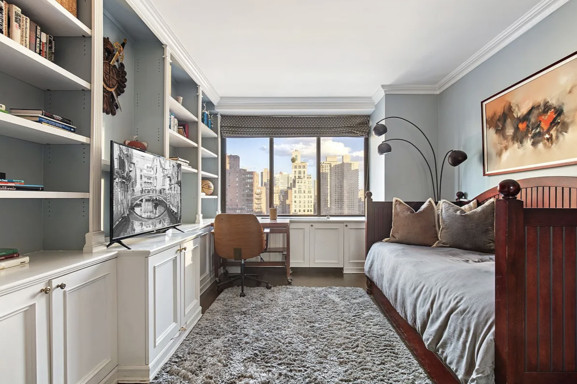 1441 3rd Avenue, Unit 14A Manhattan, NY 10028 - Photo 8 of 10 a bed room with a bed and a couch