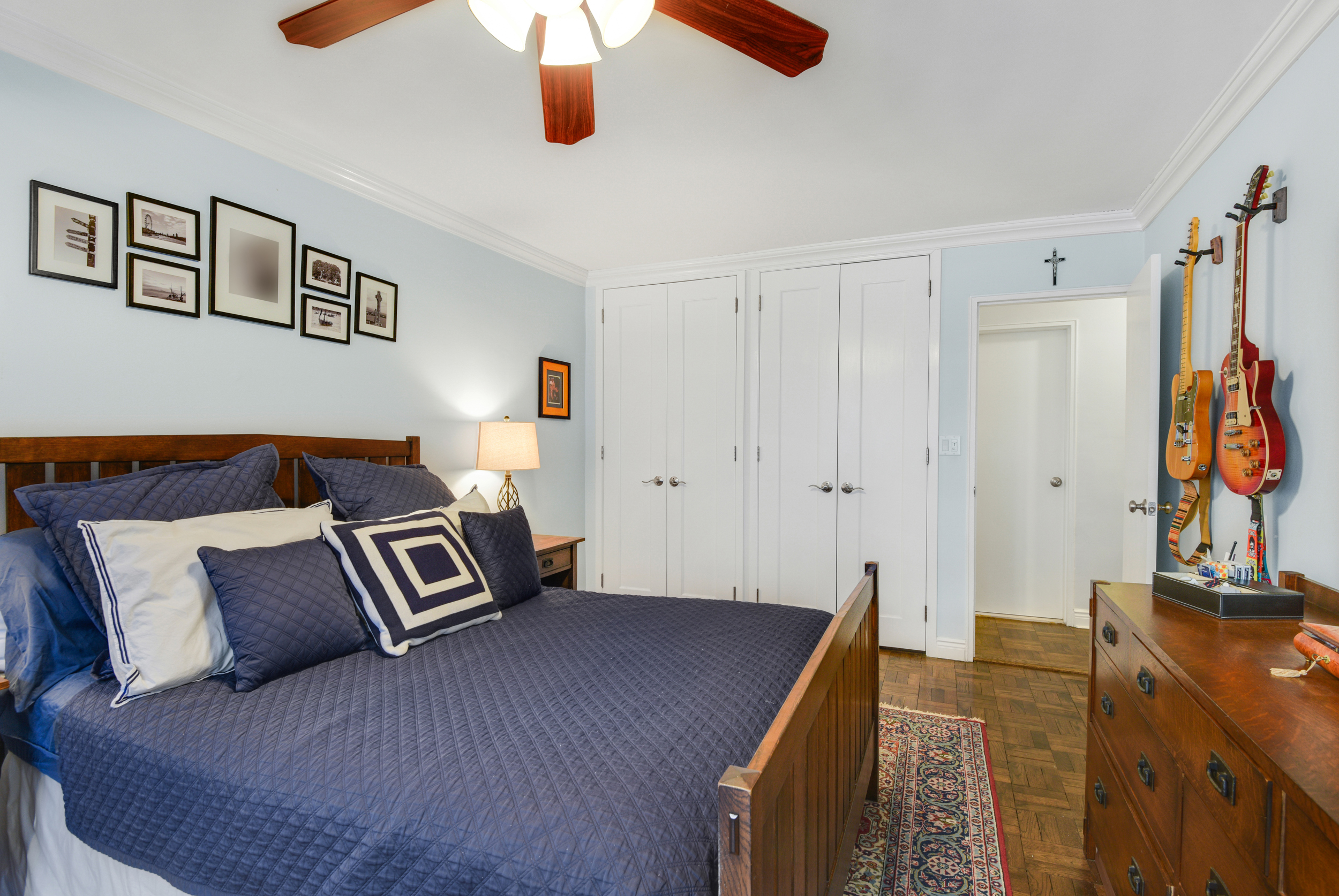 345 East 73rd Street, Unit 7J Manhattan, NY 10021 - Photo 9 of 13 a spacious bedroom with a bed and a flat tv screen