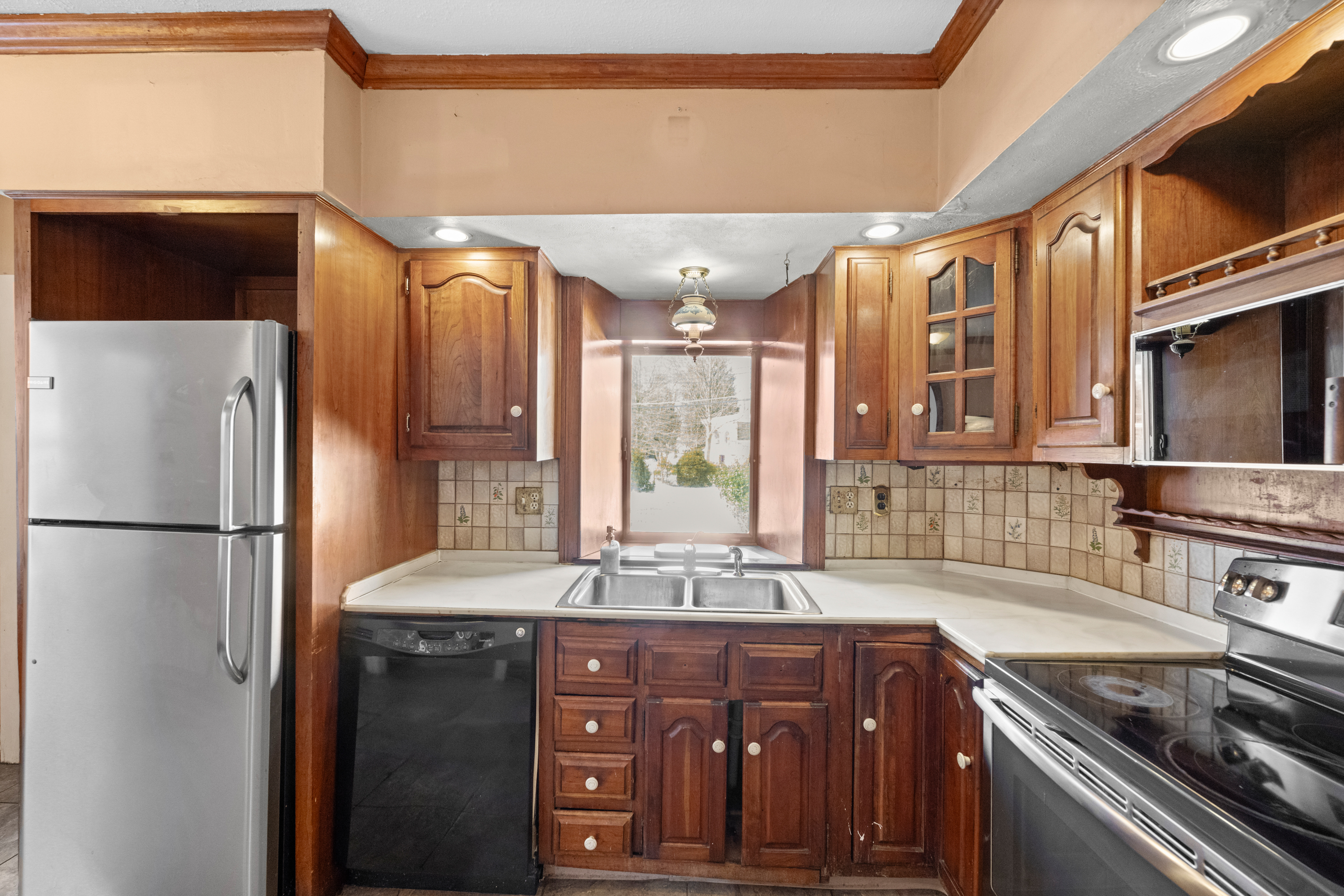 458 Renfrew Avenue Ambler, PA 19002 - Photo 10 of 32 a kitchen with stainless steel appliances granite countertop a refrigerator a sink and a stove