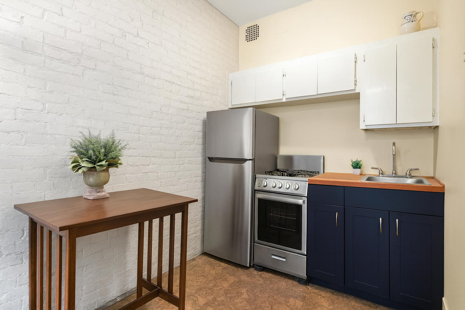 293 Riverside Drive, Unit 2B Manhattan, NY 10025 - Photo 3 of 6 a kitchen with stainless steel appliances a stove a refrigerator and a sink
