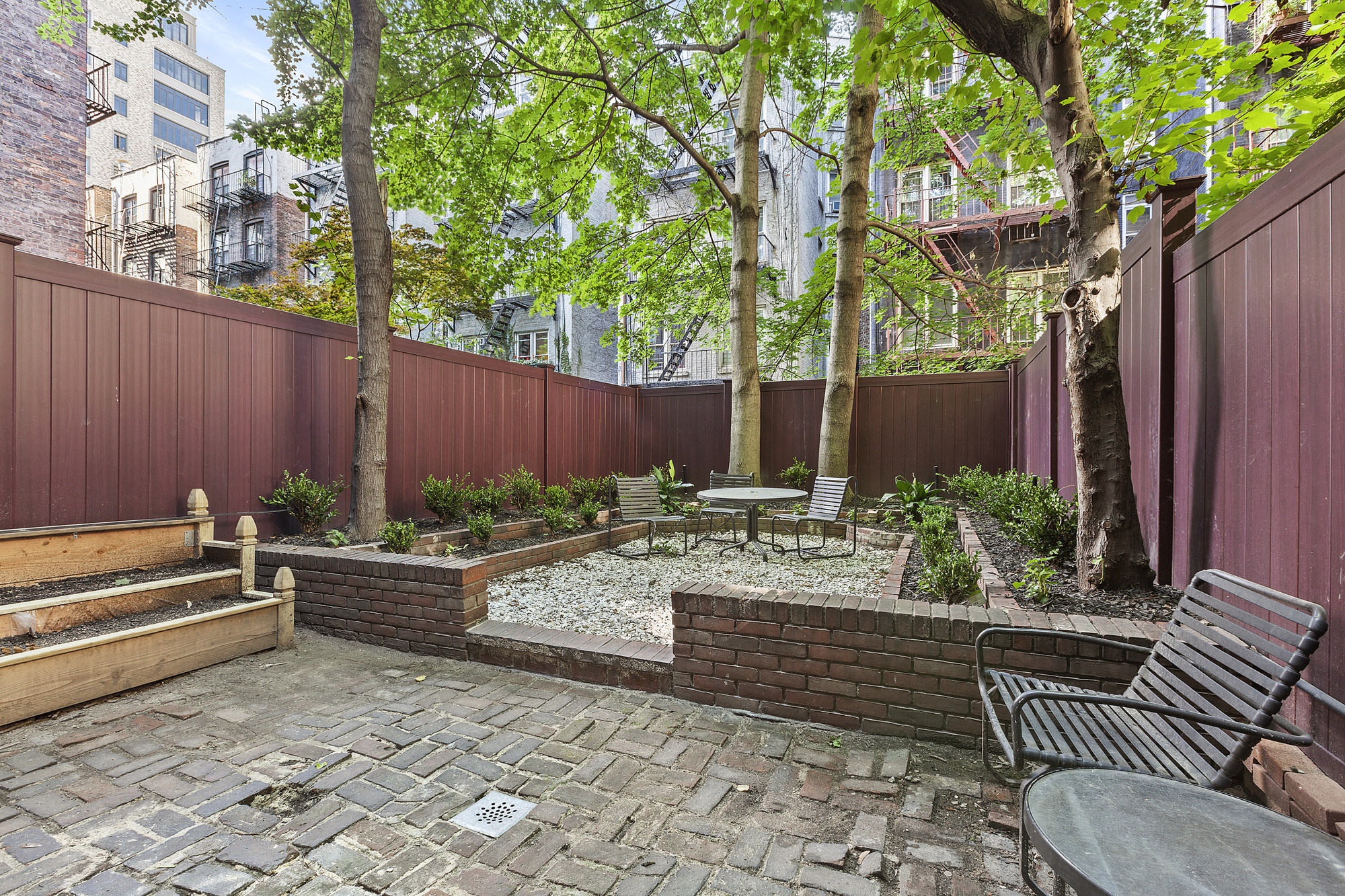 522 East 82nd Street, Unit 1 Manhattan, NY 10028 - Photo 2 of 16 a view of a backyard with sitting area