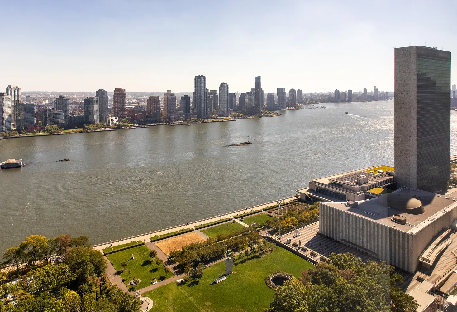 a view of a terrace with chairs and a lake view