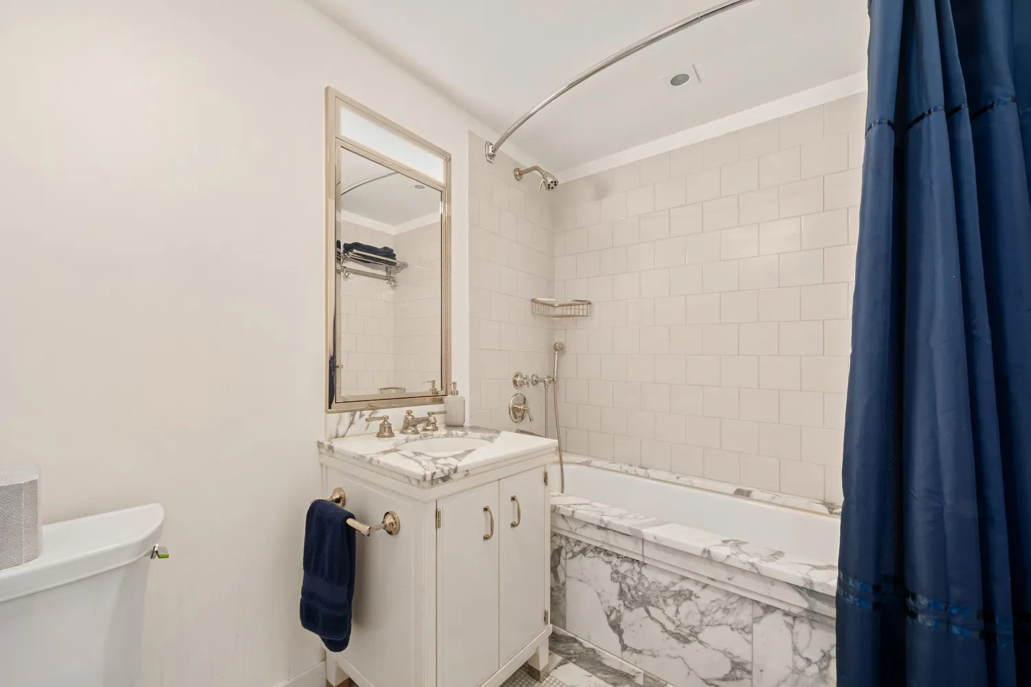 a bathroom with a sink a vanity and a mirror