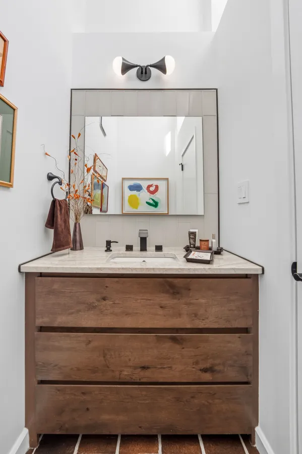 a bathroom with a sink and a mirror