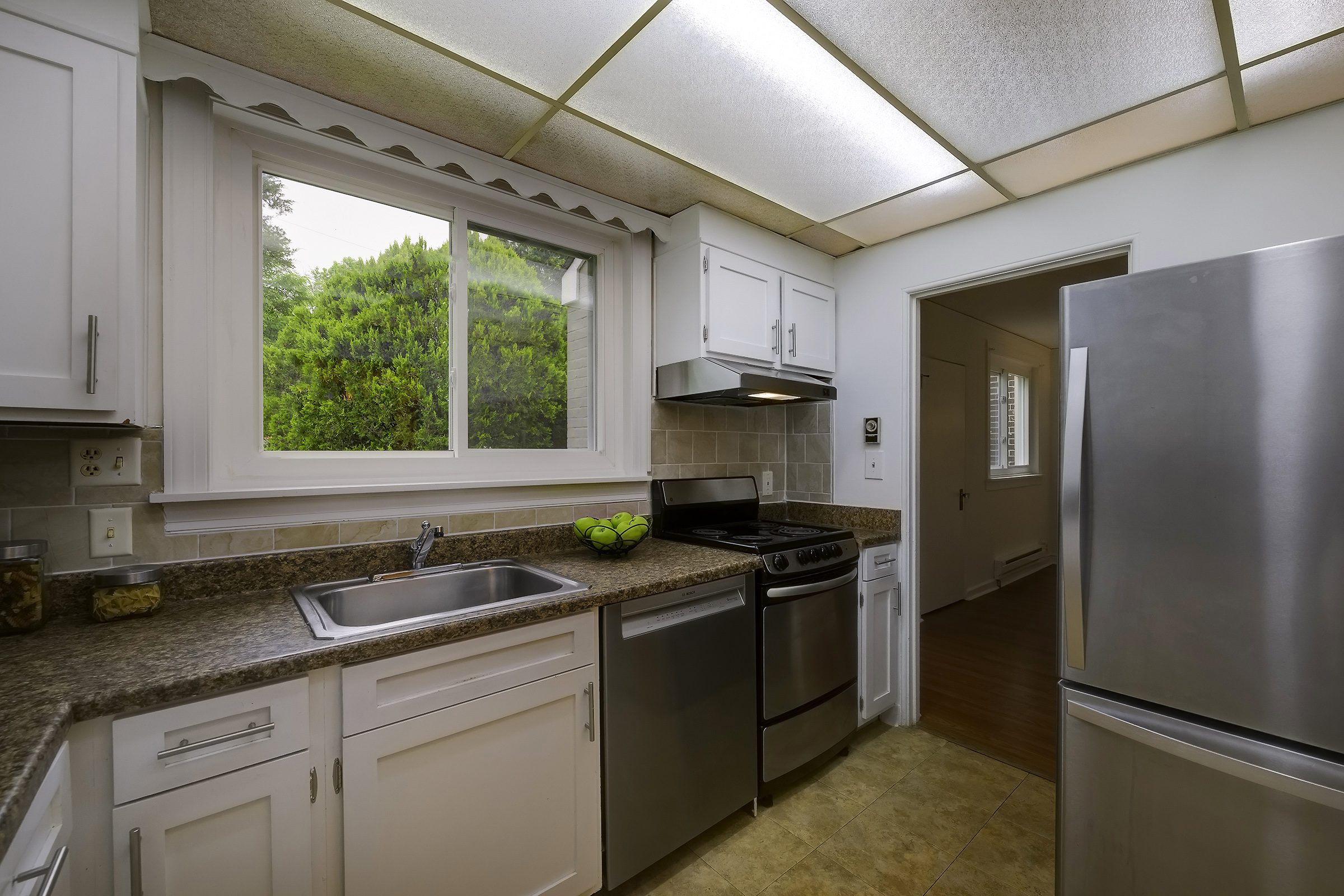 45 D Ridge Road Greenbelt, MD 20770 - Photo 14 of 35 a kitchen with stainless steel appliances granite countertop a sink stove and refrigerator