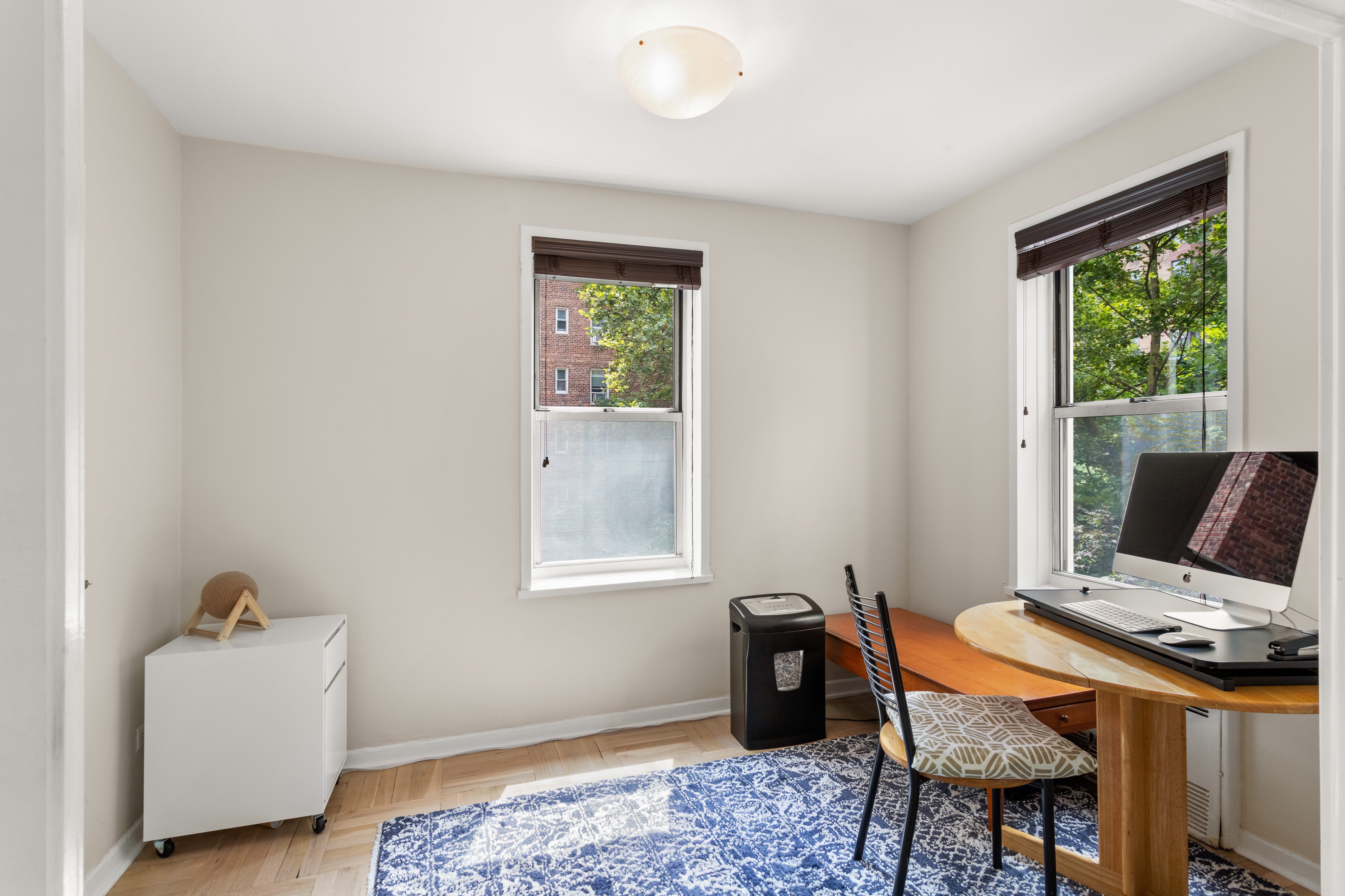 66 Overlook Terrace, Unit 4K Manhattan, NY 10040 - Photo 6 of 26 a workspace with furniture and window