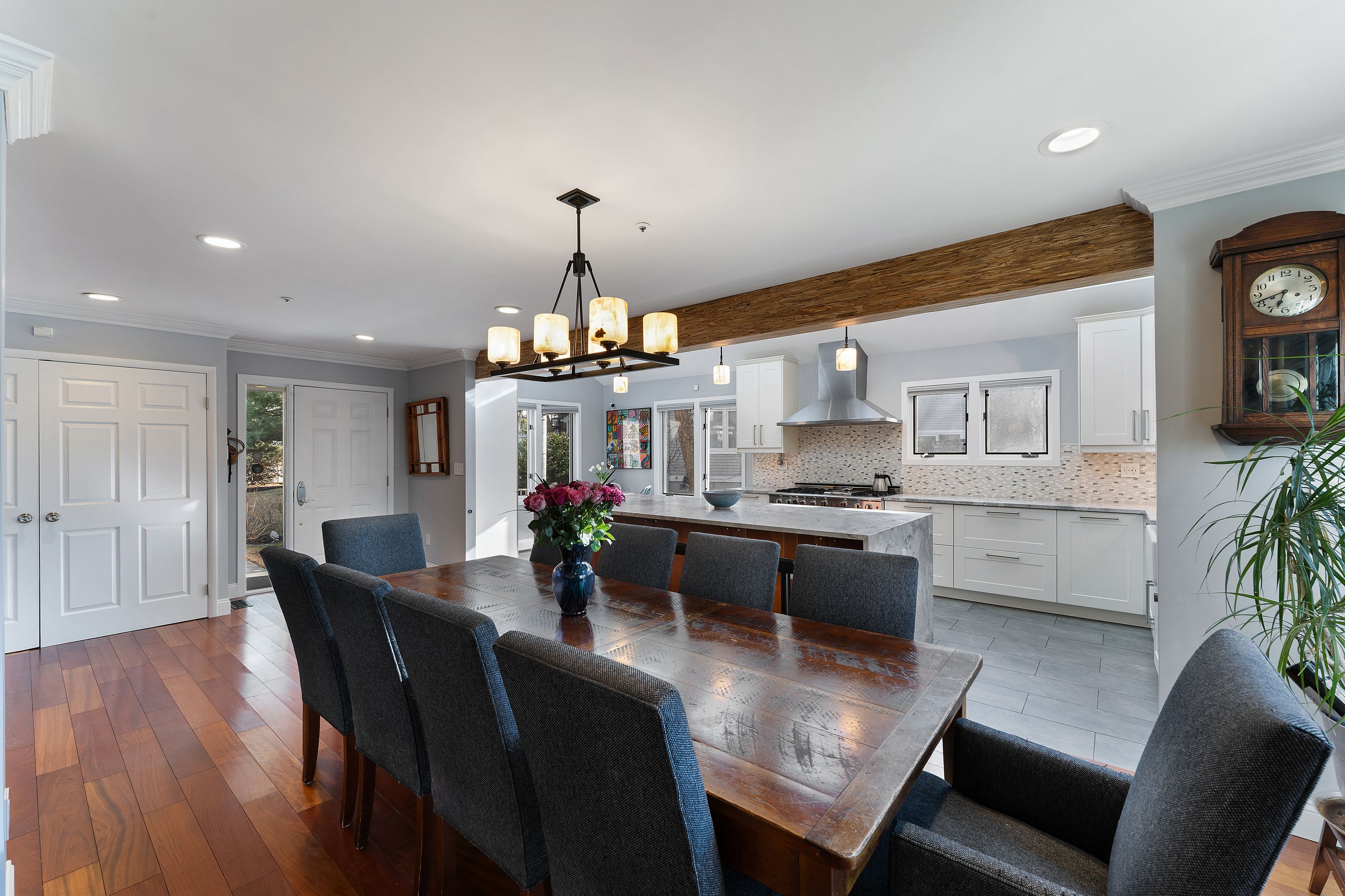 124 Boulder Ridge Road Scarsdale, NY 10583 - Photo 3 of 31 a large kitchen with a table and chairs
