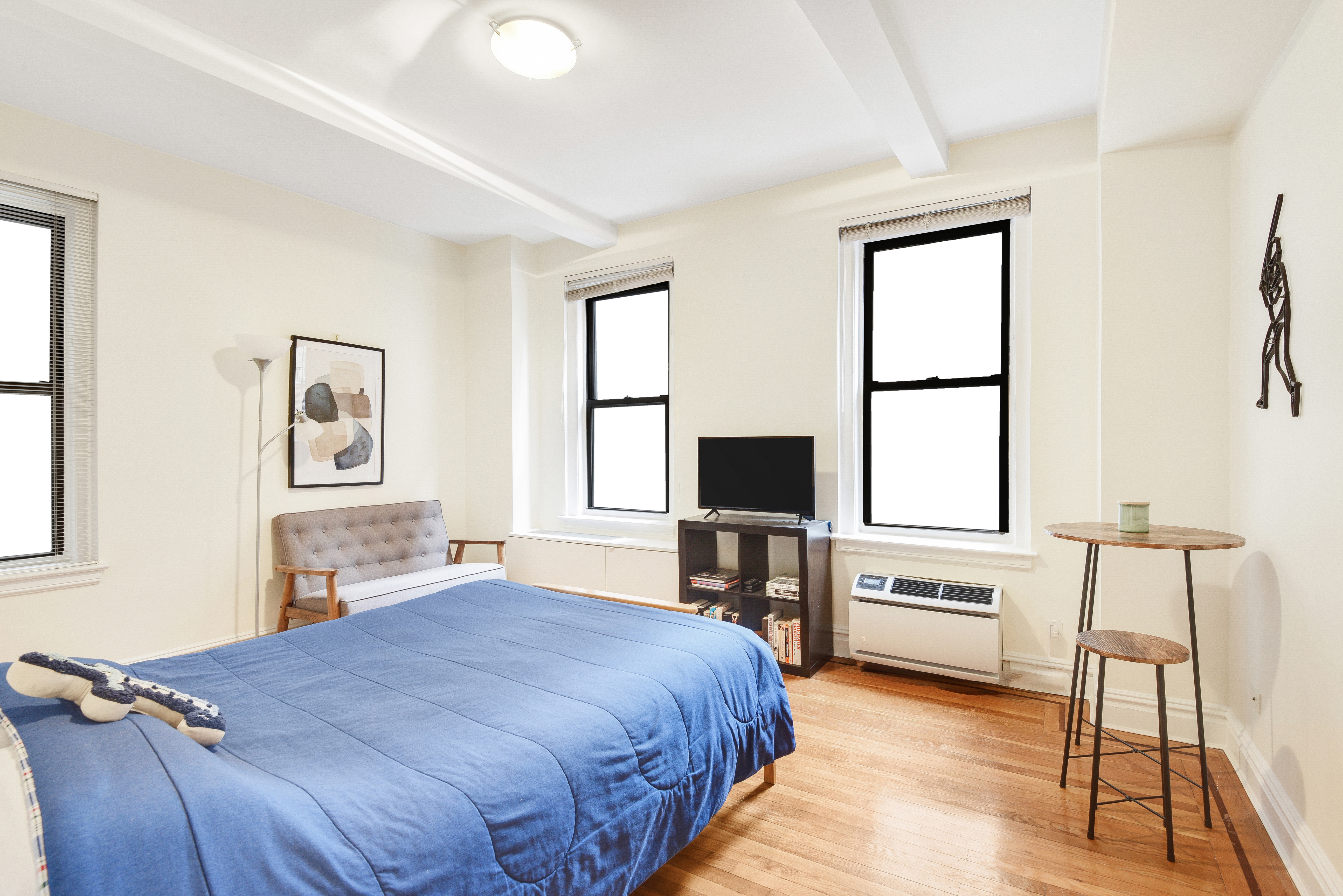 321 West 90th Street, Unit 2F/3F Manhattan, NY 10024 - Photo 10 of 15 a bedroom with a bed and a flat screen tv