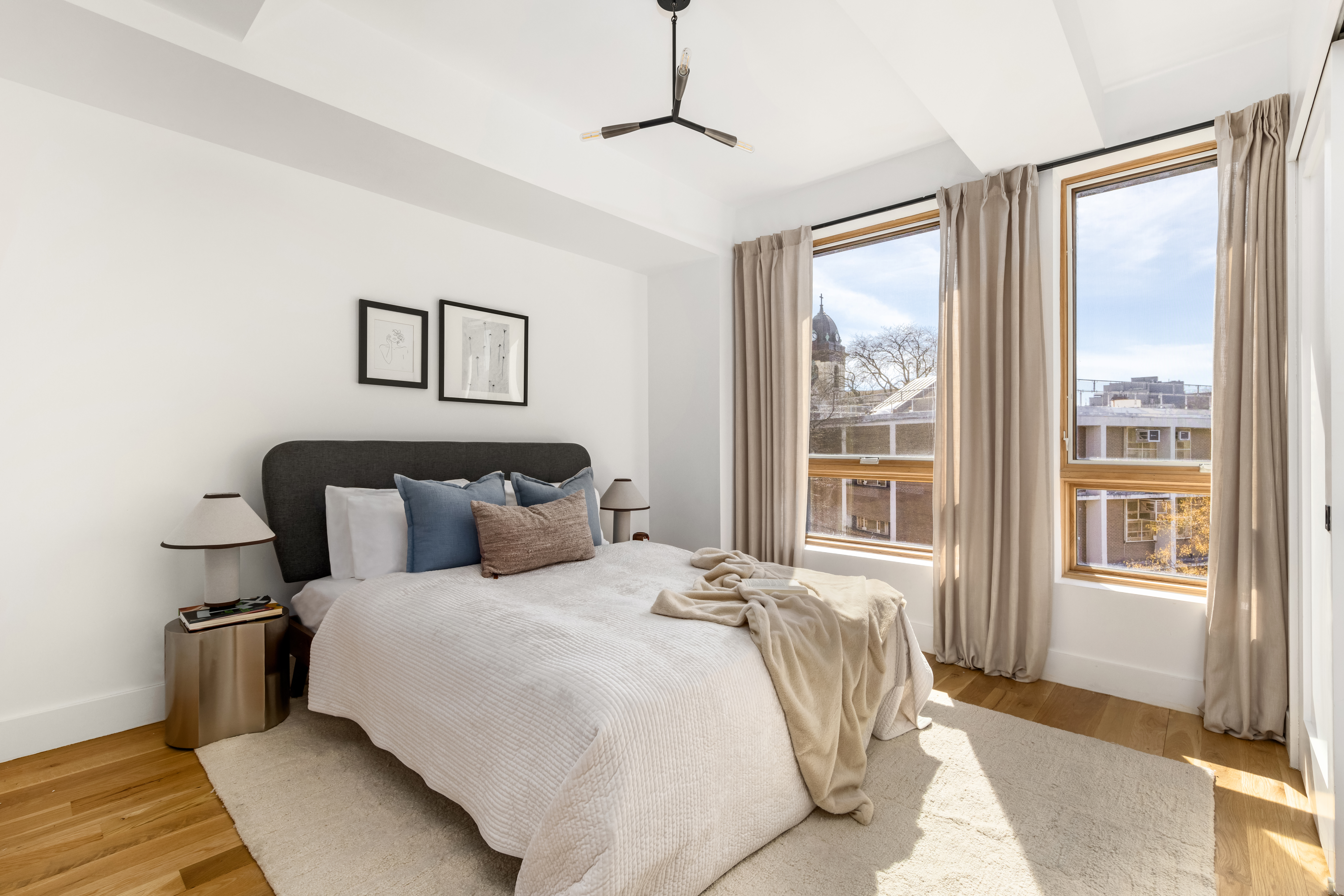 529 Park Place, Unit 401 Brooklyn, NY 11238 - Photo 6 of 13 a bedroom with a large bed and a window