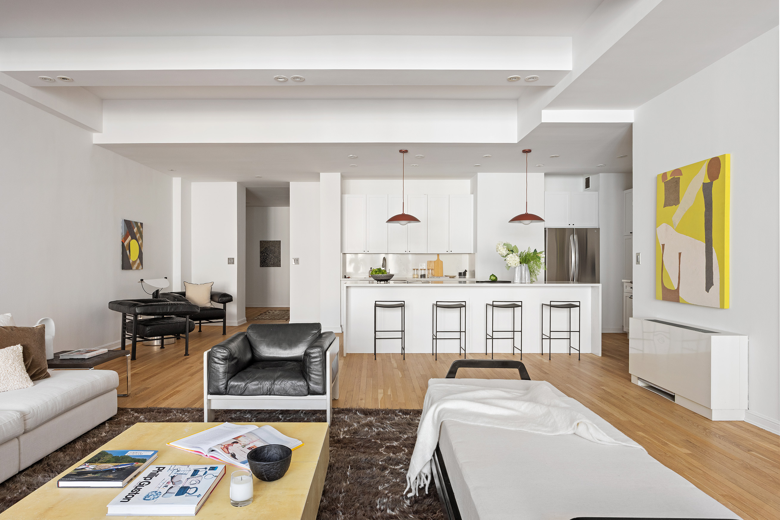 252 7th Avenue, Unit 9R Manhattan, NY 10001 - Photo 8 of 23 a living room with furniture and a table