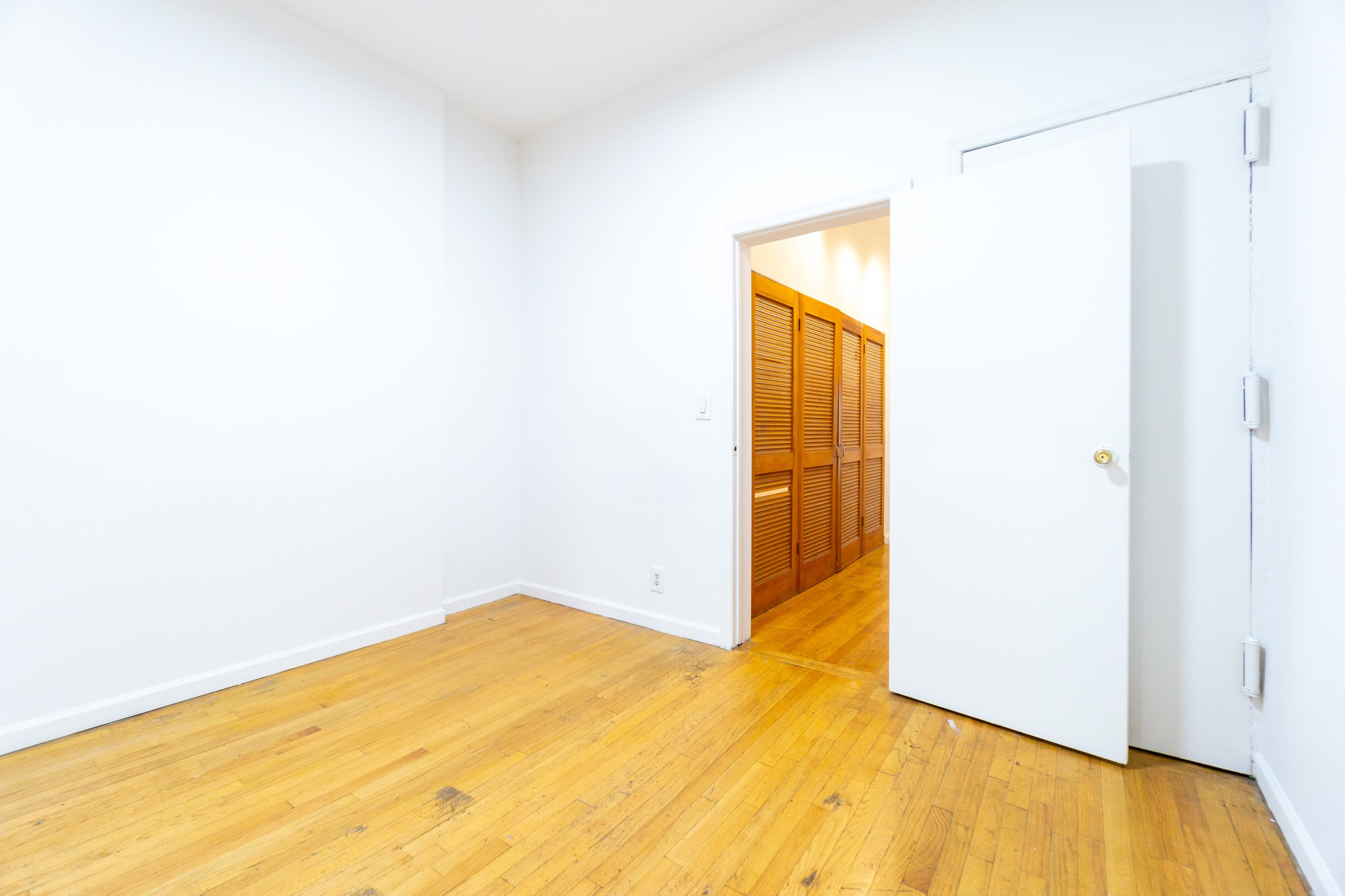 215 East 5th Street, Unit 3 Manhattan, NY 10003 - Photo 8 of 25 a view of a big room with wooden floor