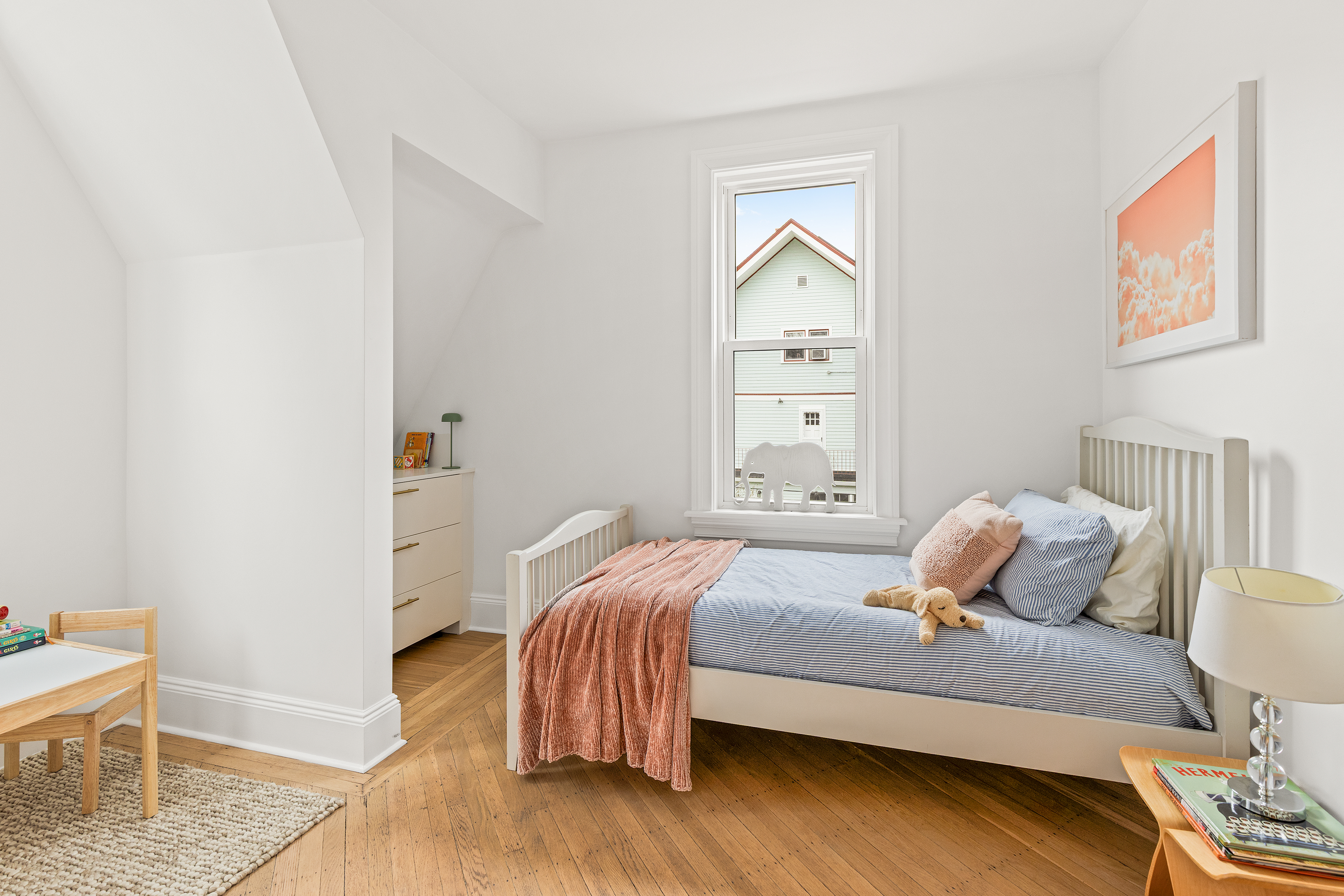 467 Rugby Road Brooklyn, NY 11226 - Photo 10 of 22 a bedroom with a bed and wooden floor