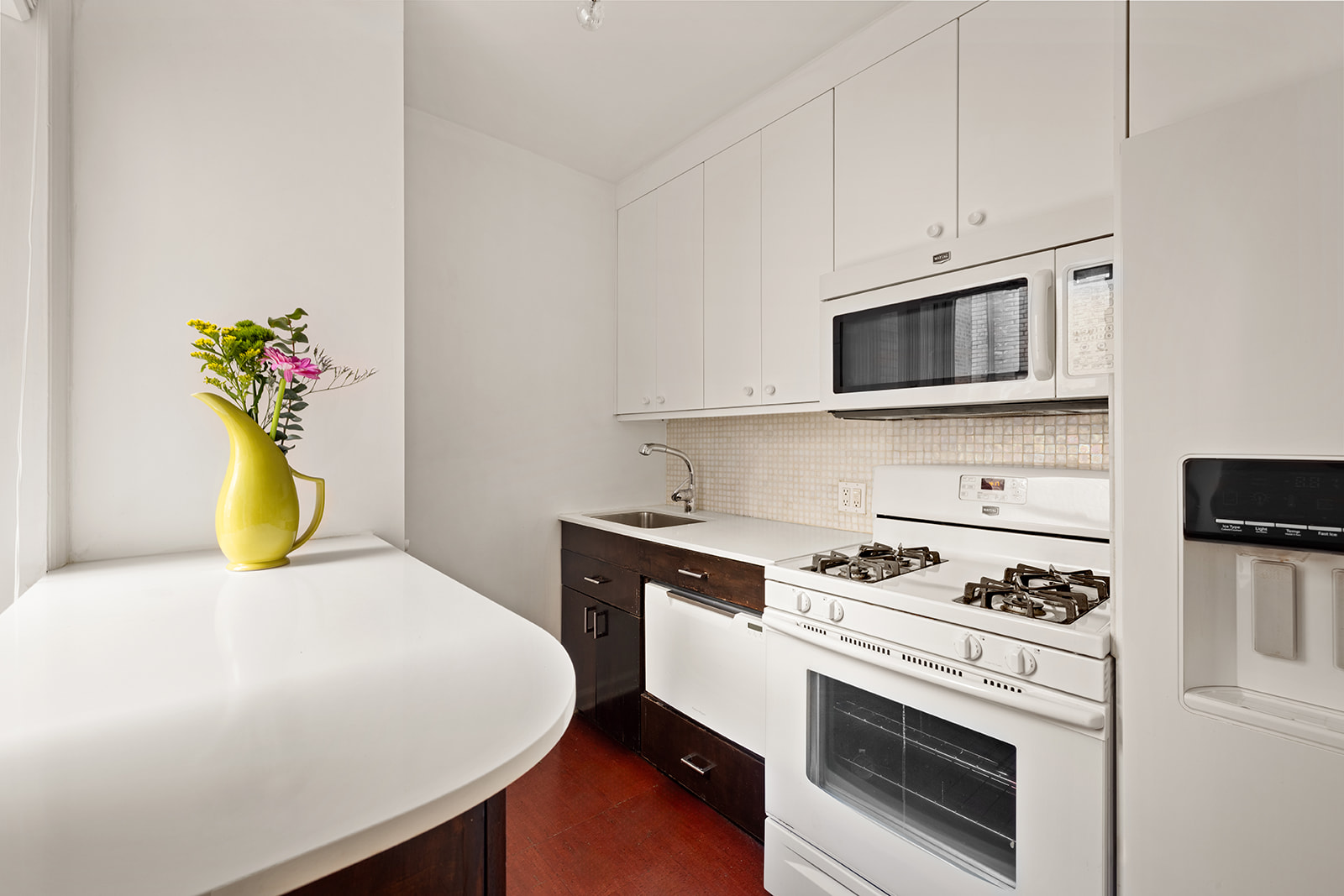 73 Columbia Heights, Unit C1 Brooklyn, NY 11201 - Photo 9 of 14 a kitchen with a white stove and microwave