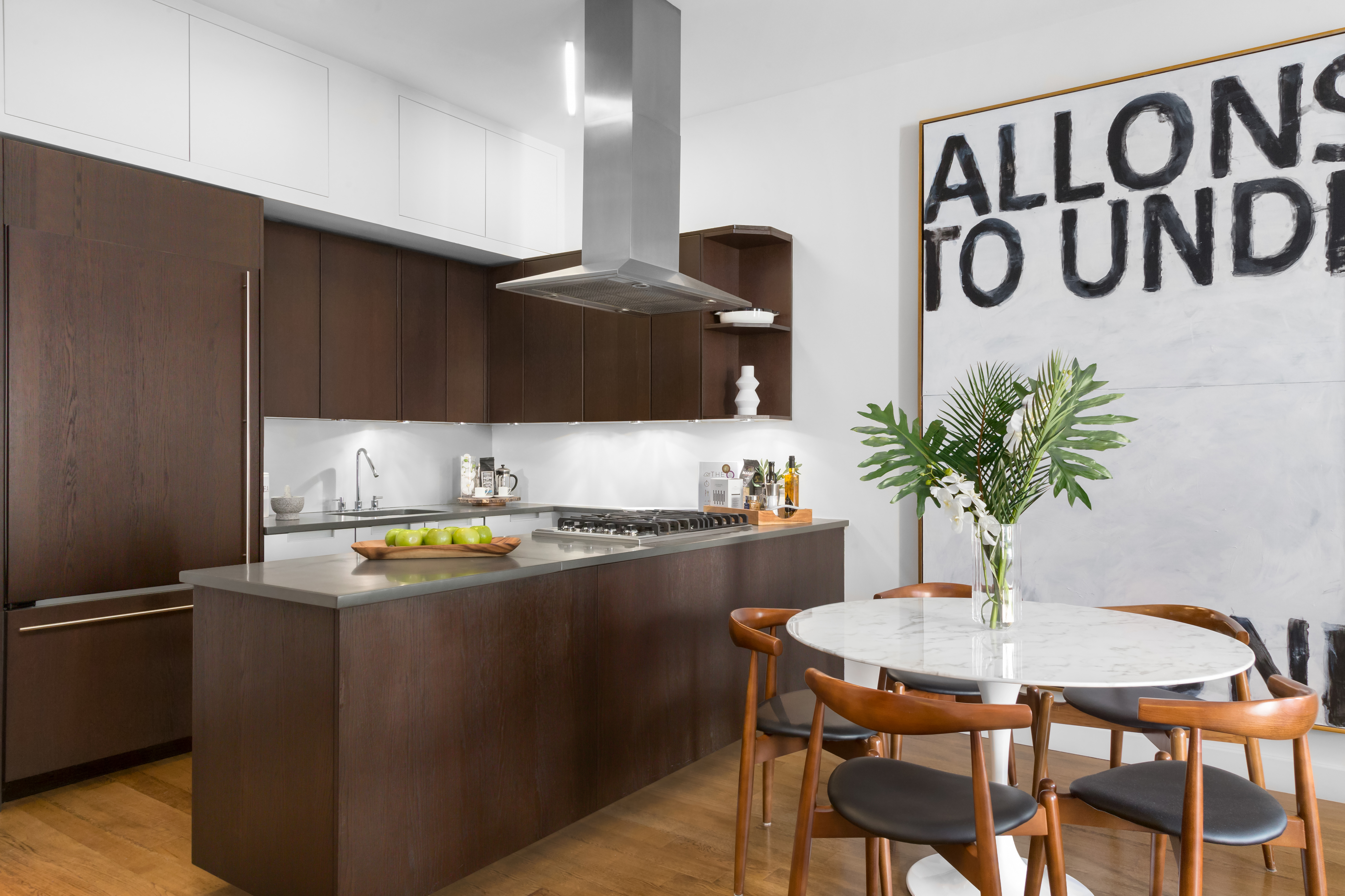 225 5th Avenue, Unit PHY Manhattan, NY 10010 - Photo 5 of 10 a kitchen with stainless steel appliances granite countertop a sink and a refrigerator