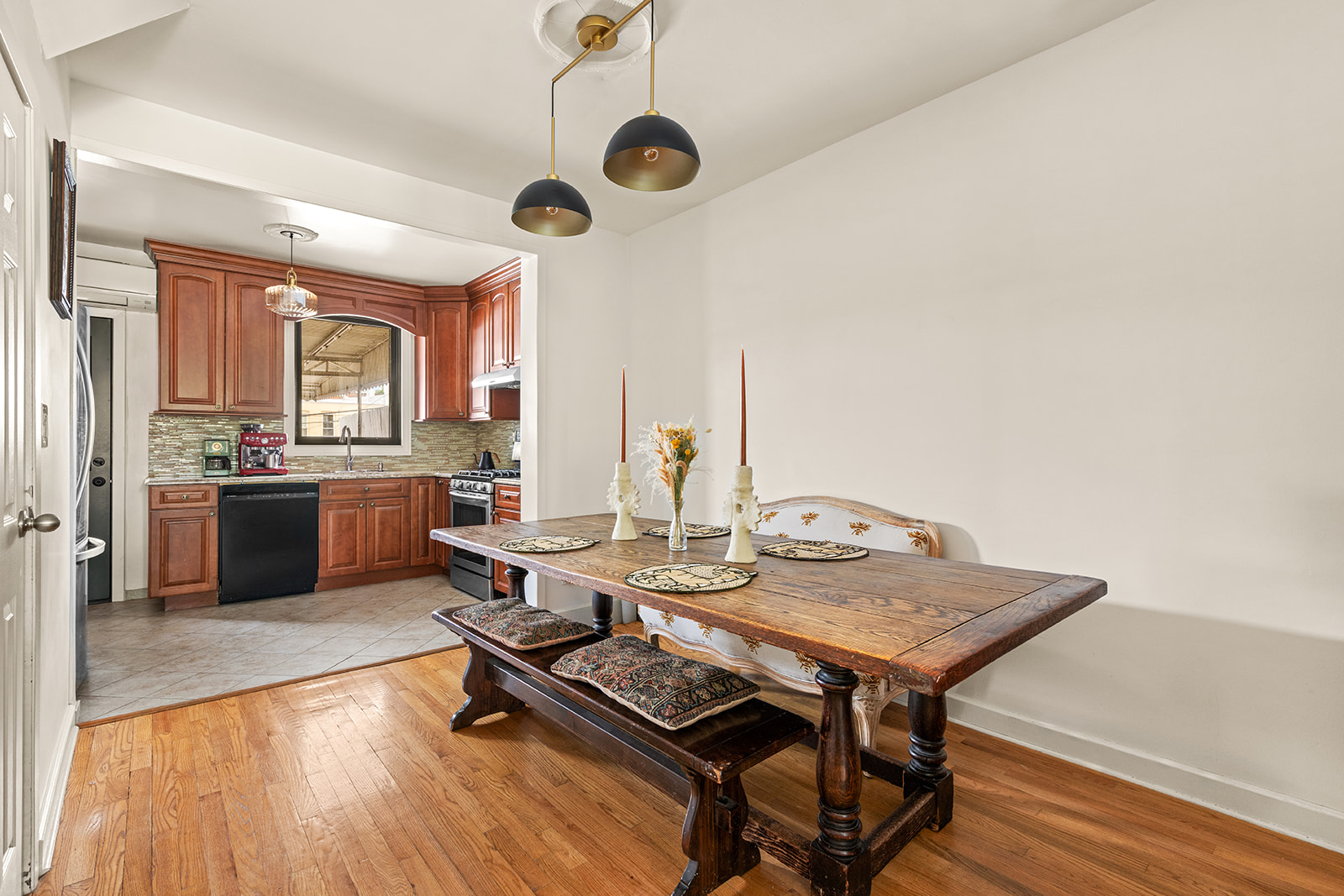 570 19th Street Brooklyn, NY 11218 - Photo 4 of 13 a view of a kitchen with a table and chairs