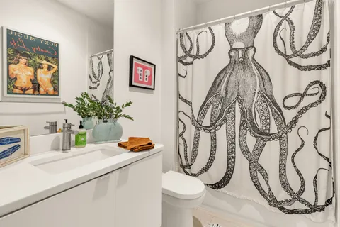 a bathroom with a toilet and a sink